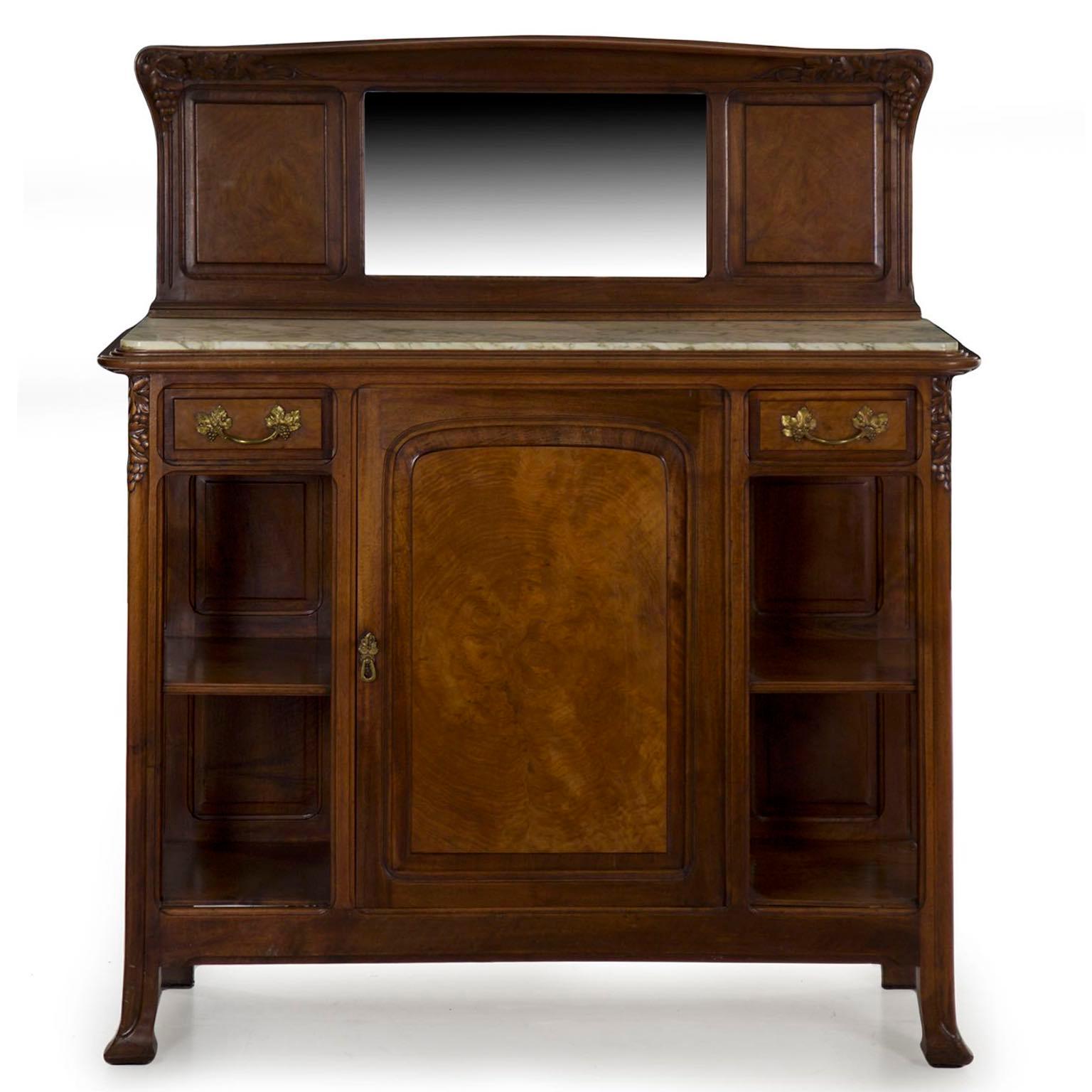 A most striking presentation piece, this server is crafted with a very fine grade of materials throughout; the burl walnut veneers in the door, drawers and panels flanking the mirror are very powerful and well chosen timbers. Where naturalism and