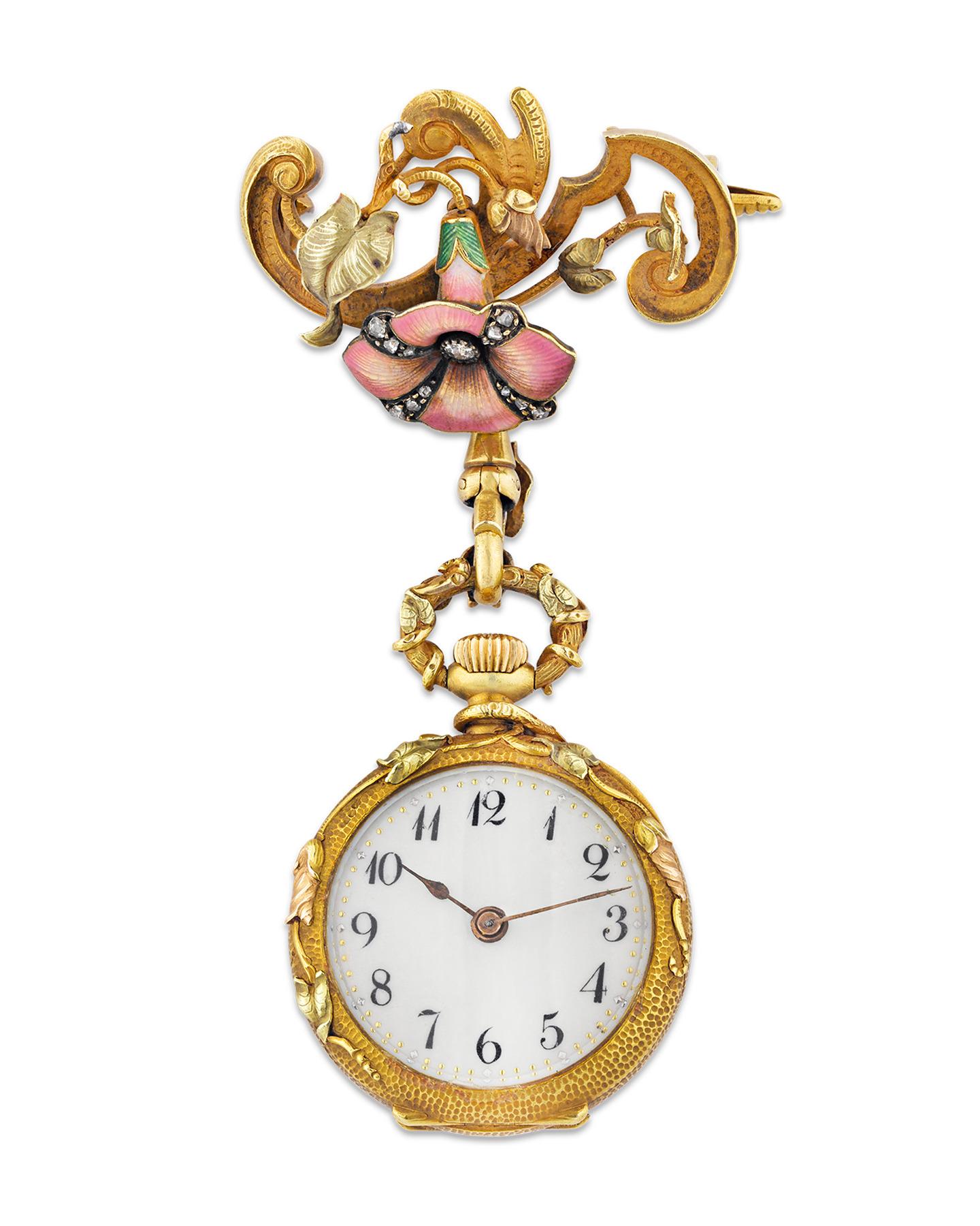 This beautiful French watch pendant features a sublime, organic floral motif indicative of Art Nouveau jewelry design. Crafted of 18K gold, this elegant timepiece is enveloped in graceful angel trumpets adorned with diamonds and brilliant pink and