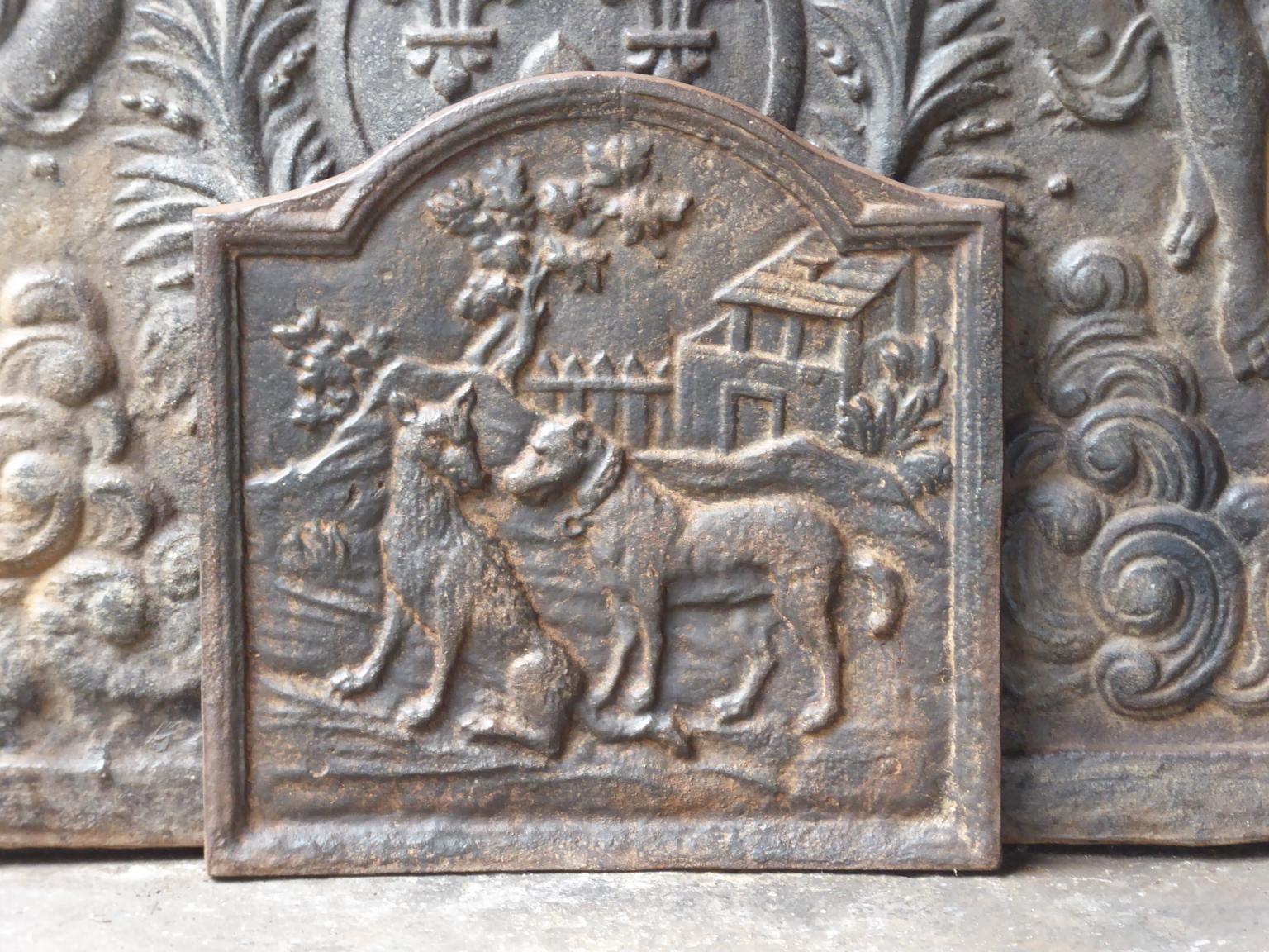 20th century French Art Nouveau fireback with the fable of the wolf and the dog (Jean de la Fontaine 1621-1695). A hungry wolf meets a well-fed dog and compliments him on his good appearance. The dog describes his life of ease and invites the wolf