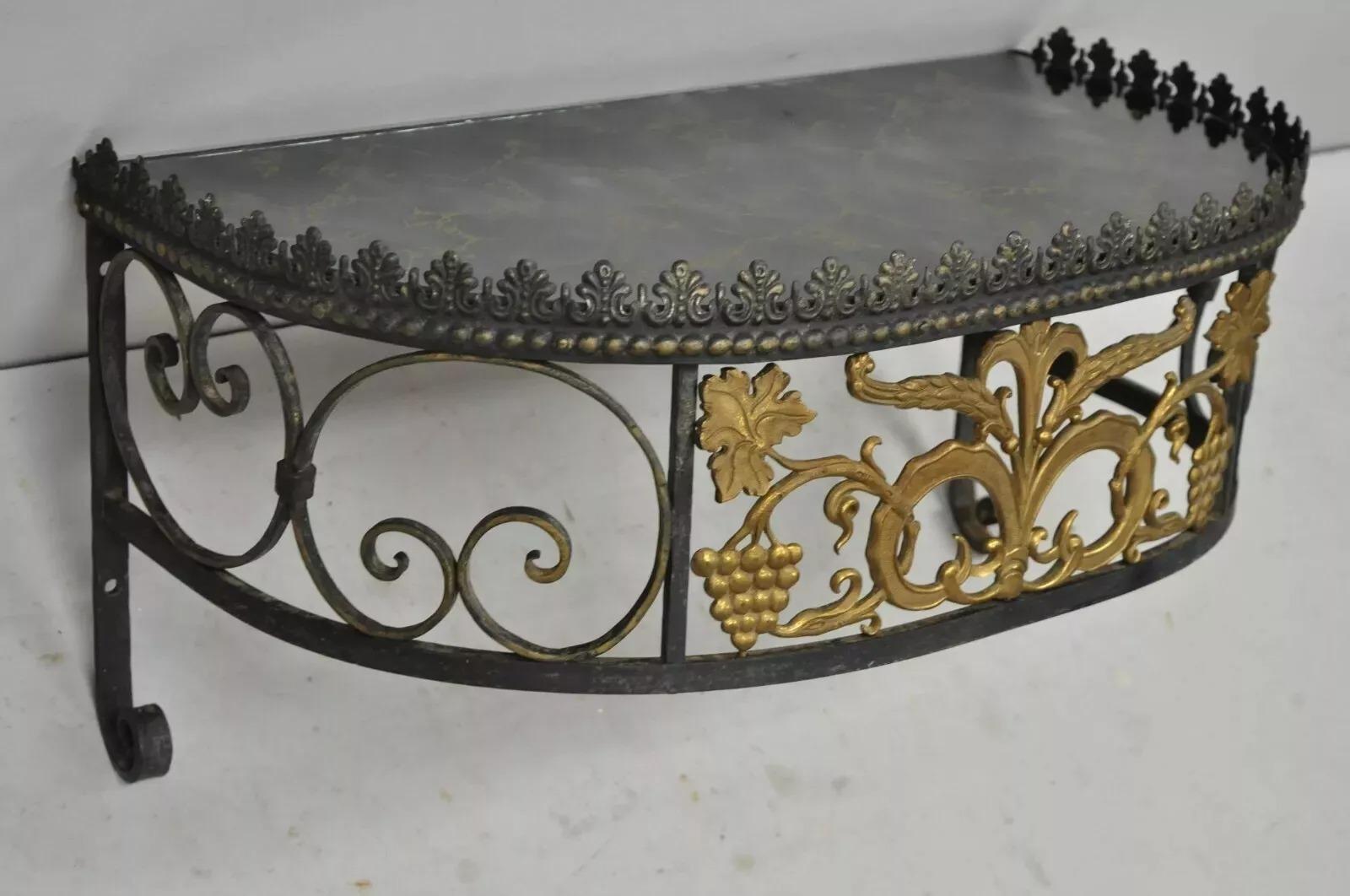 French Art Nouveau Wrought Iron Grapevine Maple Leaf Wall Mounted Console Table. Item features half round eglomise glass top, scrolling wrought iron frame, maple and grapevine design, wrought iron construction, very nice antique item, great style