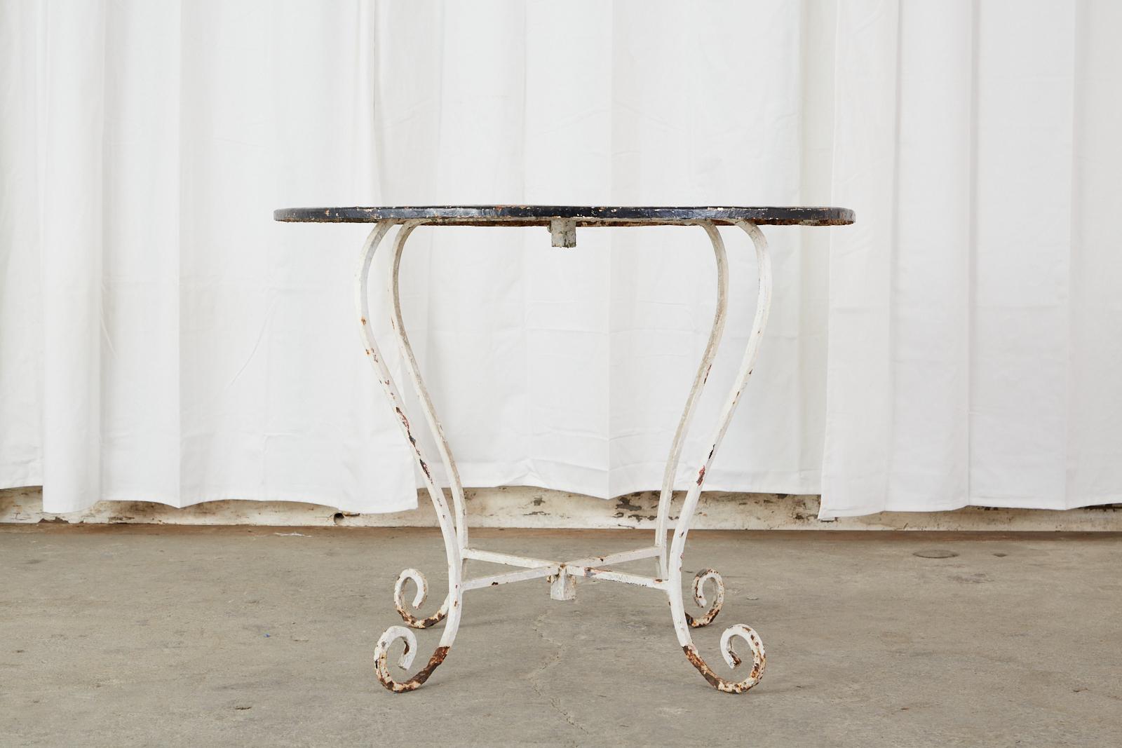 French Art Nouveau Wrought Iron Zinc Painted Garden Table In Distressed Condition In Rio Vista, CA