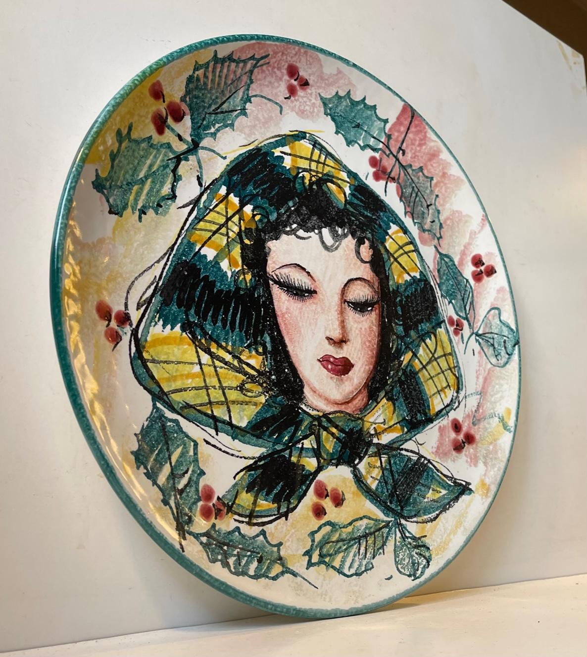 Large Delicately glazed hand-painted charger dish or wall platter depicting a young female in headscarf. It is hand signed indistinguishable/unknown, France, 66. I can be displayed on the wall or used as a centerpiece bowl/charger. Measurements: D: