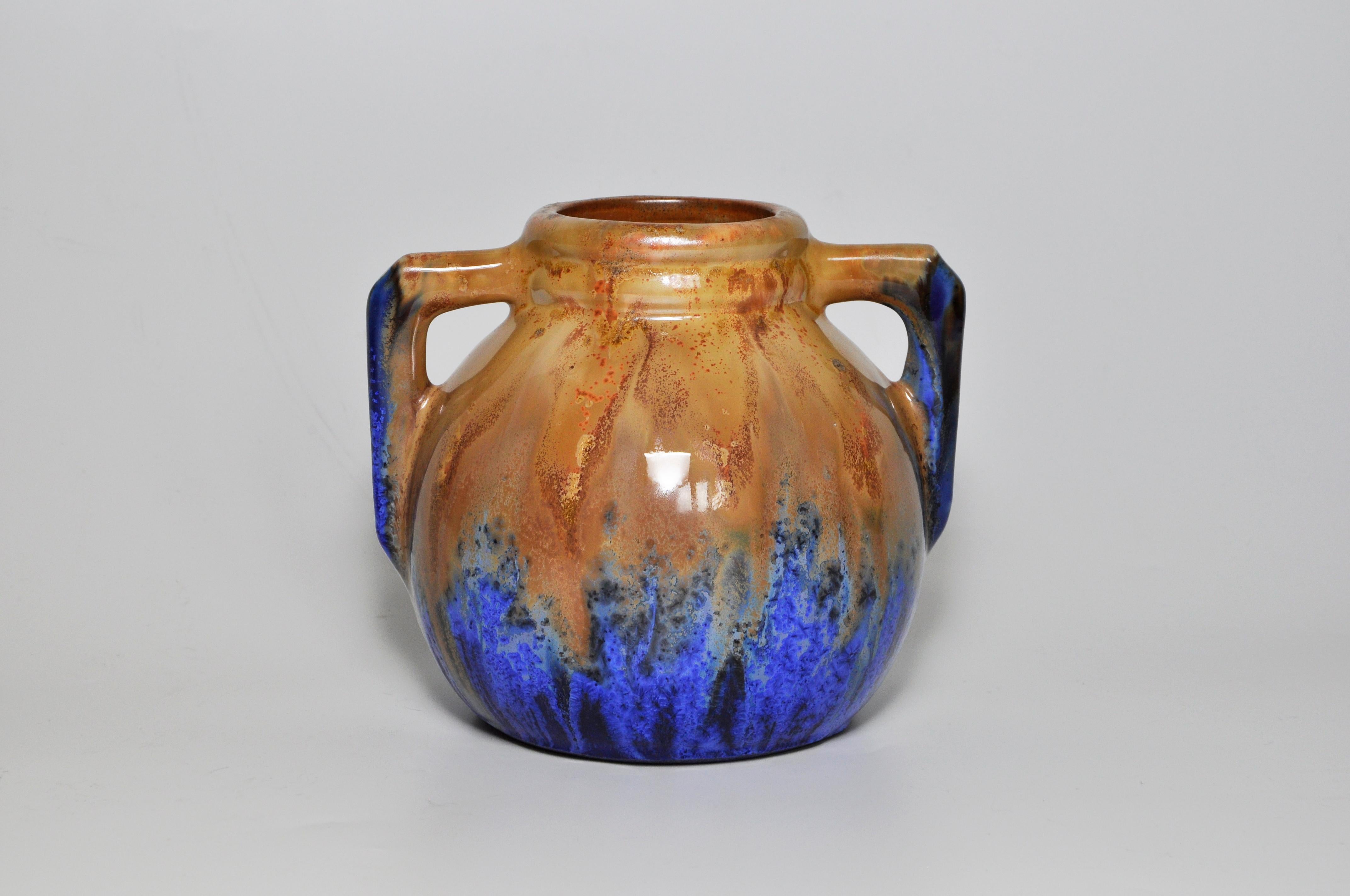 French Art Pottery Metenier blue ceramic vase pot

Made from stoneware and signed on the base by ‘G.Métenier’ for Gilbert Metenier. An artist potter who worked from 1907 until 1940 noted for his variety of shapes and interesting experimental glaze