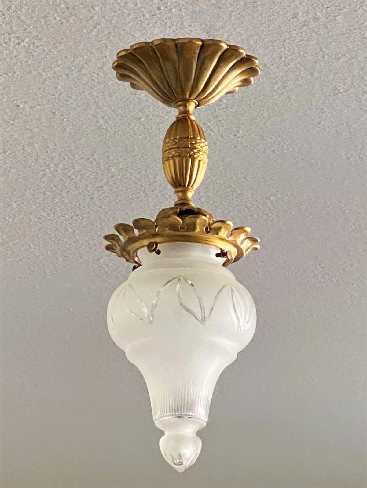 A lovely cut glass and gilt bronze flush mount/ceiling France, 1930s. This beautiful piece is very good condition, aged patina to gilt bronze, no chips or cracks, rewired.
One brass and porcelain E27 light socke for a large sized E27 screw bulb.
