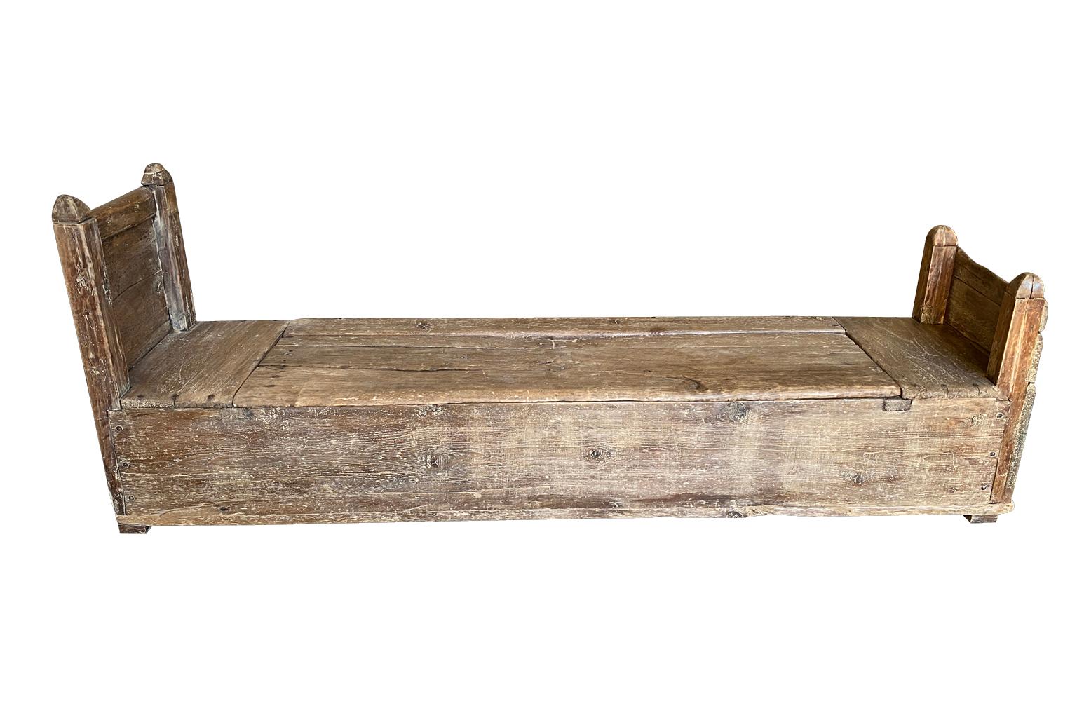 A sensational 18th century primitive Arte Populaire bench - coffre from the Ardeche region of France.  Wonderfully constructed from naturally washed pine with a super patina.  The seat lifts to reveal the coffre storage space.