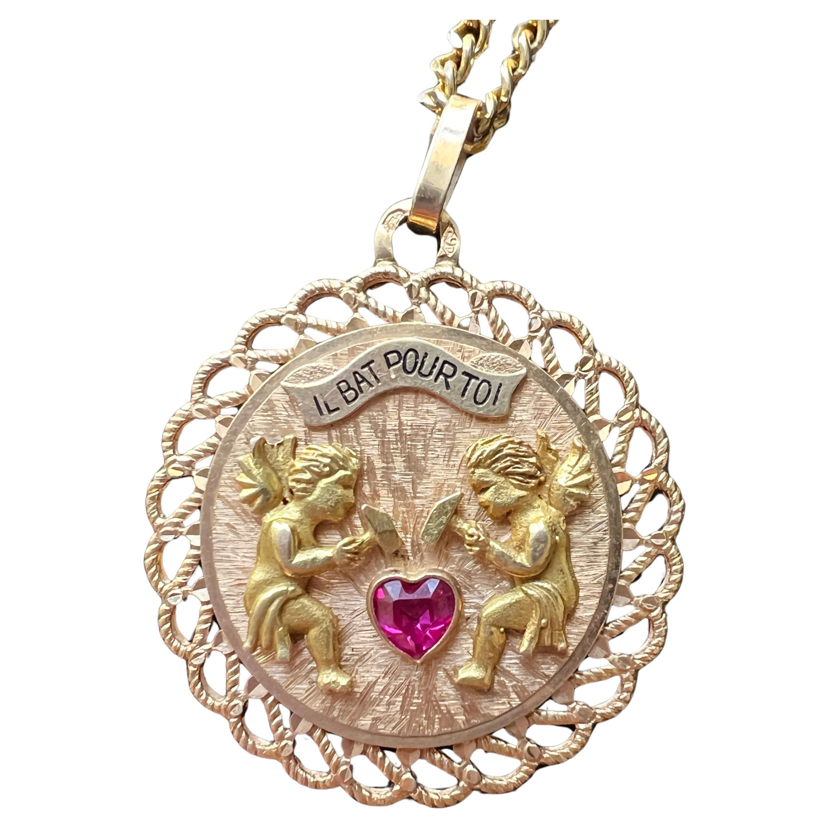 French articulated 18K gold “my heart beats for you” medal pendant