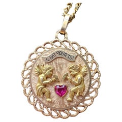 Vintage French articulated 18K gold “my heart beats for you” medal pendant