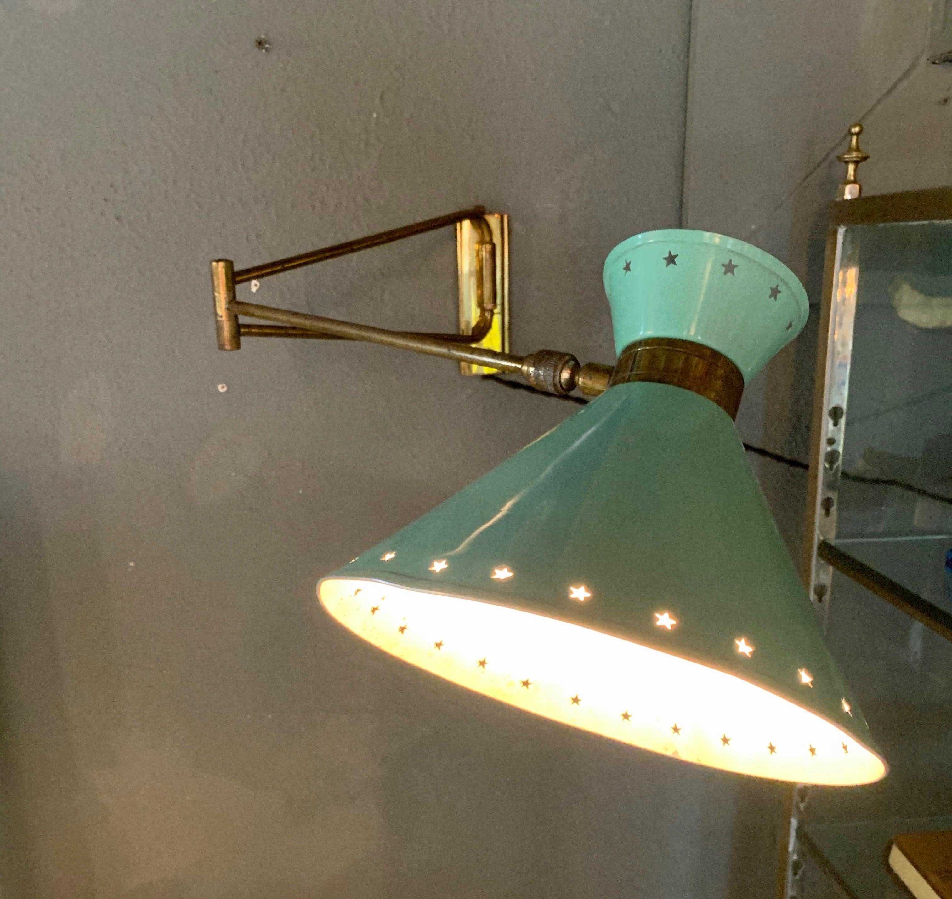 Fantastic articulating sconce by Lunel. Aluminum shade with original green paint, brass backplate, arms and hardware. Sconce pulls out from the wall or tucks in. Also able to angle the shade in different directions. Newly rewired. Good vintage