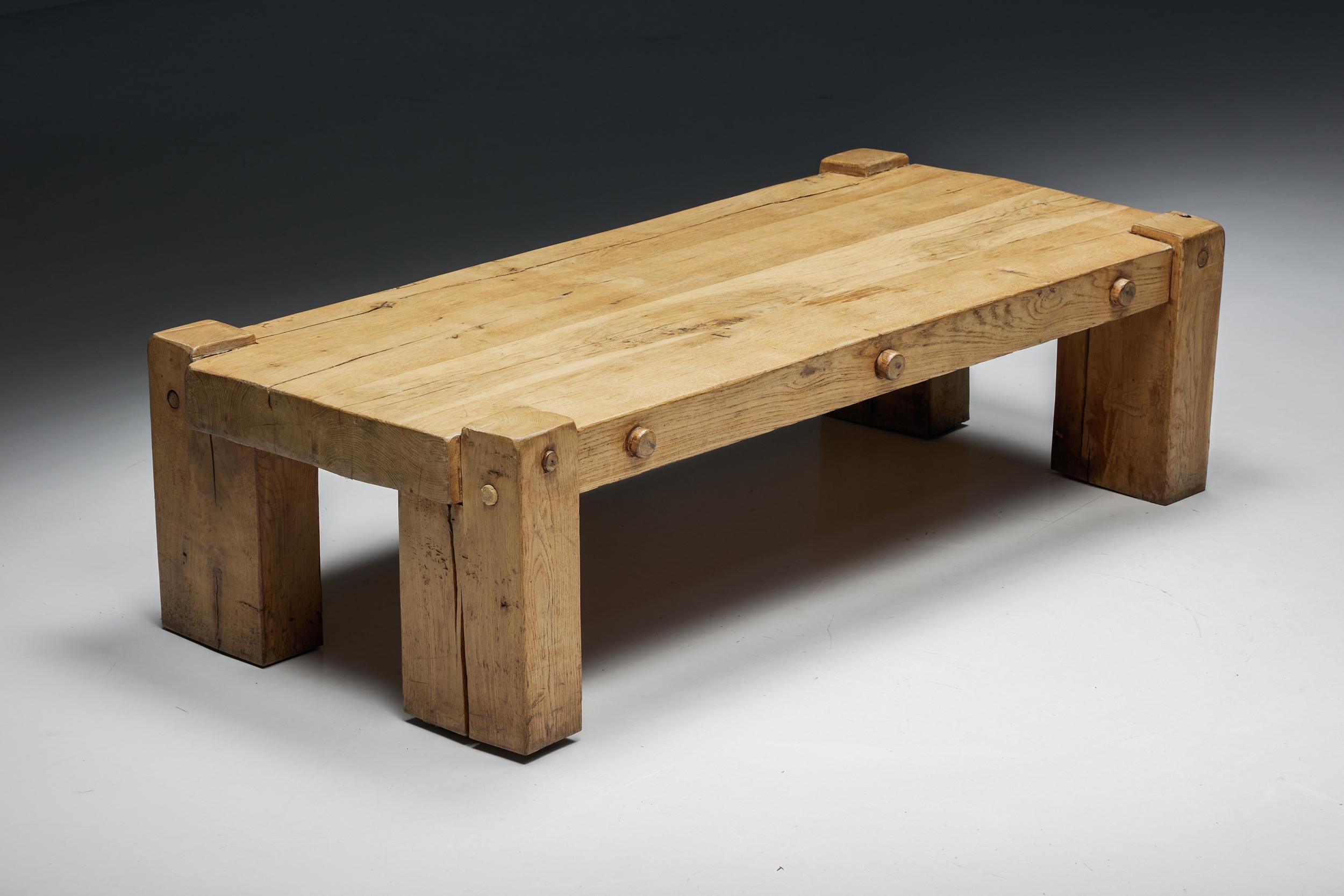 Brutalist; solid wood; coffee table; france; 1940s; rustic; wabi-sabi; coffee table; side table; wood; patina; mid-century modern; craftsmanship; robust; rustic; rural; travail brutaliste;

Rustic artisan brutalist coffee table with a four-legged
