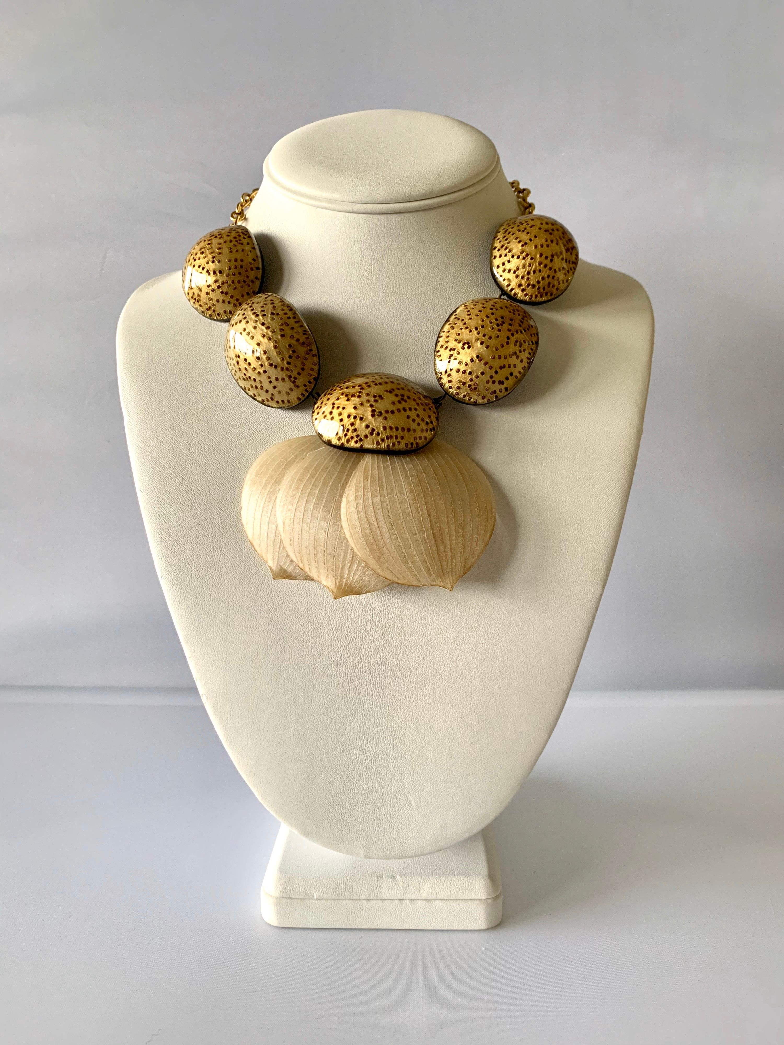 French artisan gold leaves statement necklace - the contemporary necklace is comprised of a gilt metal chain and features five three dimensional oval segments finished in gold enamel and resin. The oval segments have a detail that gives a
