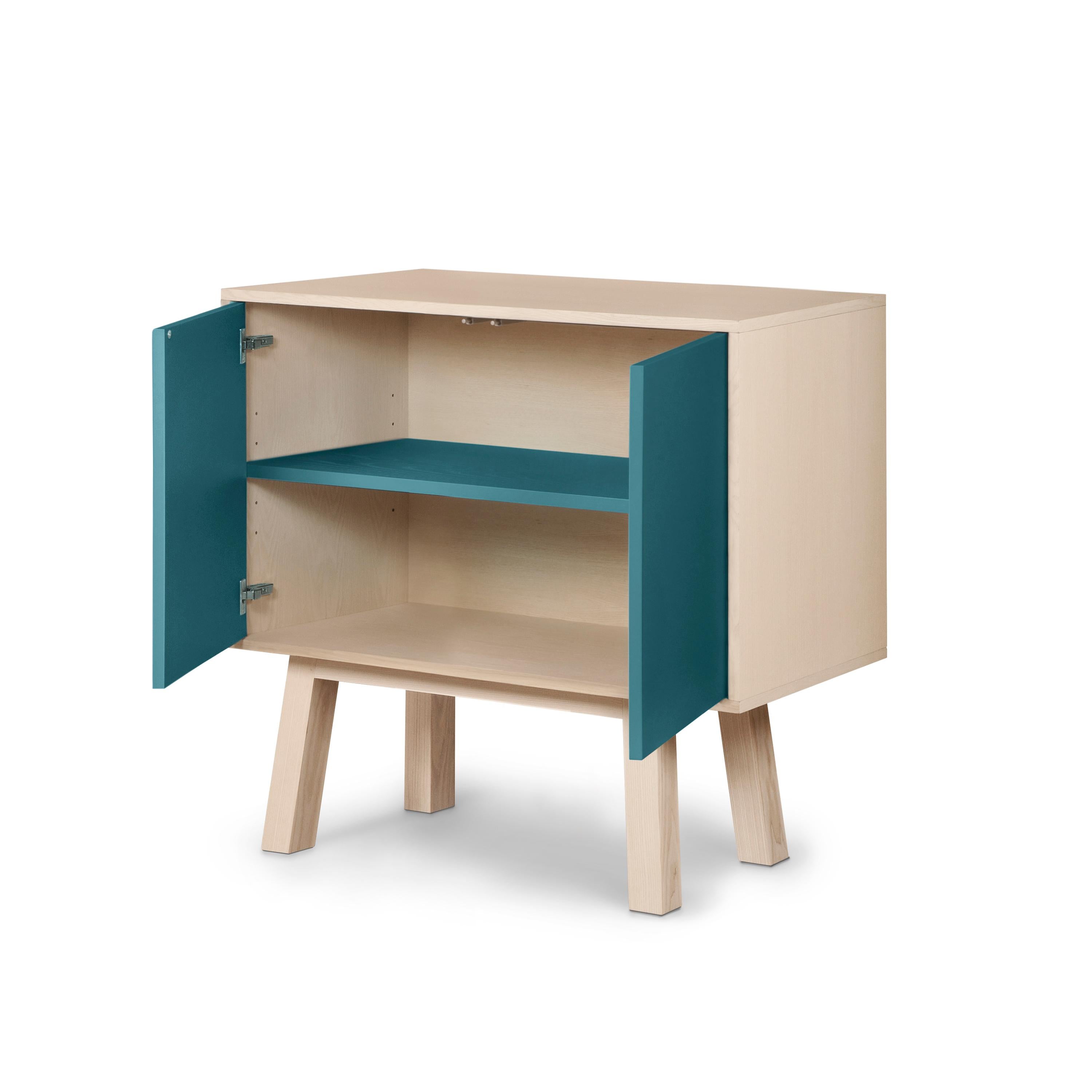 This 2-door cabinet is designed by Eric Gizard, Paris and 100% handcrafted in France.

It is made of French solid ash wood, veneer adh and lacquered doors in MDF panels. 

The 2 doors open with a 