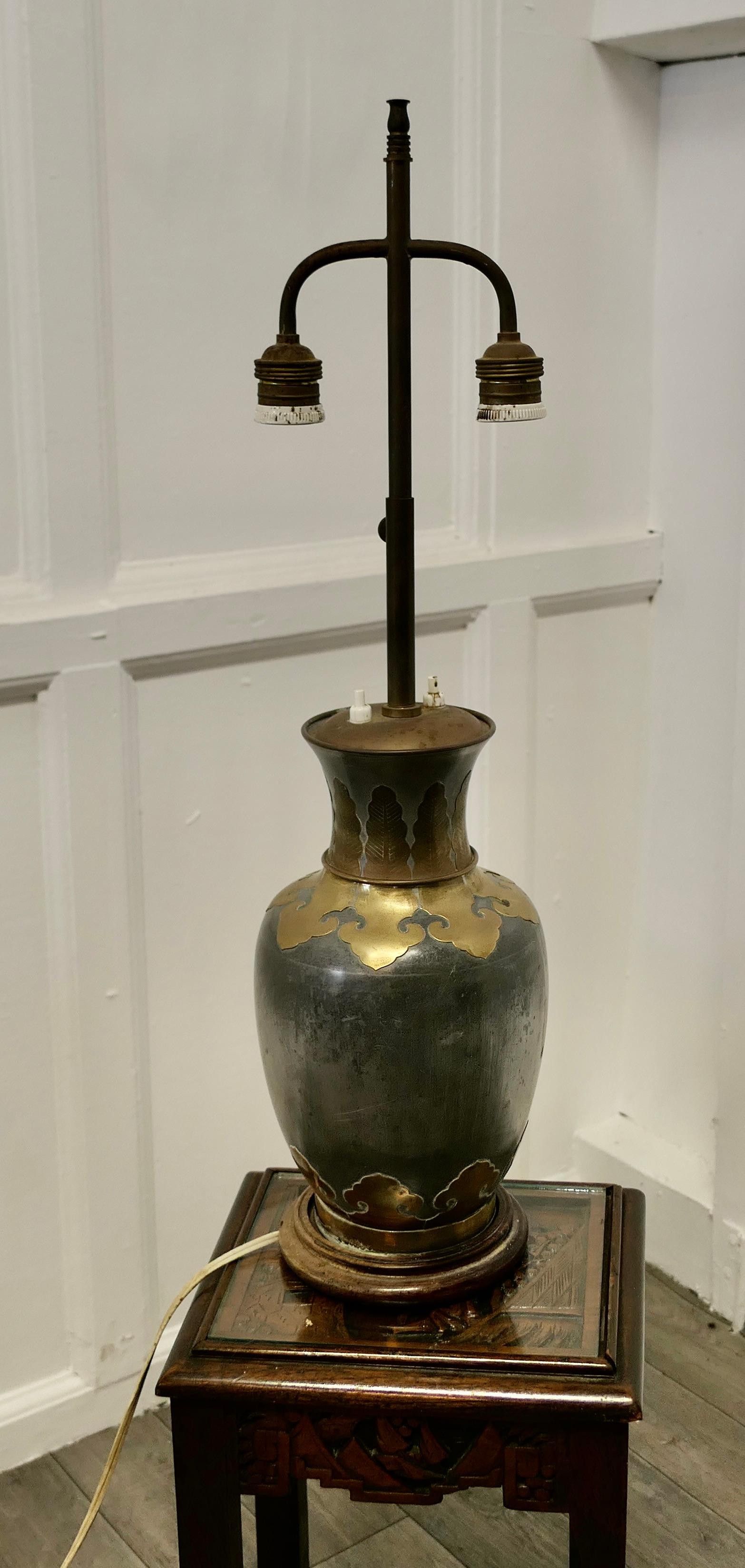 French Arts & Crafts adjustable brass and pewter table lamp.

This is a large piece it has twin lamps which are separately switched and are height adjustable together.
A superb bulbous and very stylish base made in brass and grey metal which