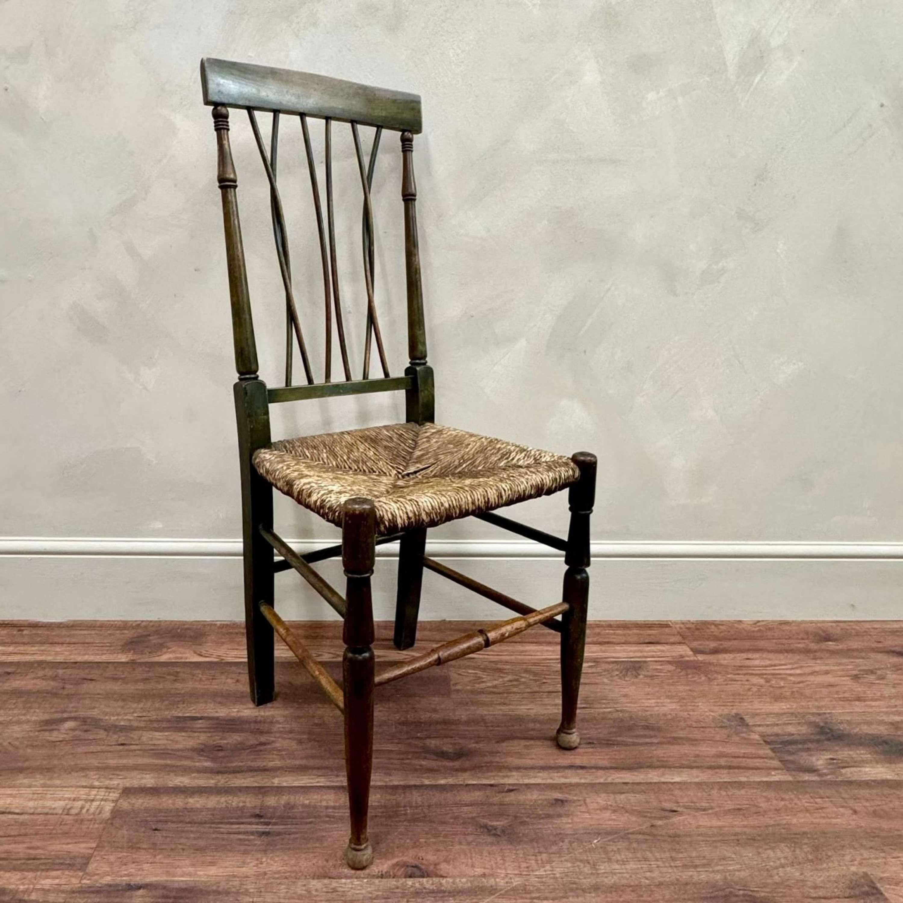 Wonderful arts and crafts rush seated chair with original green paint.
Entwined, bentwood splat, solid seat.
Originally found in a house in Cornwall where it had been for many years.
France, circa, 1900.

Back Height - 102 cm
Depth - 47.5 cm
Seat