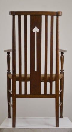 Poltrona in stile Arts & Crafts francese in rovere massiccio, design dei primi anni del XX secolo