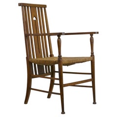 Poltrona in stile Arts & Crafts francese in rovere massiccio, design dei primi anni del XX secolo