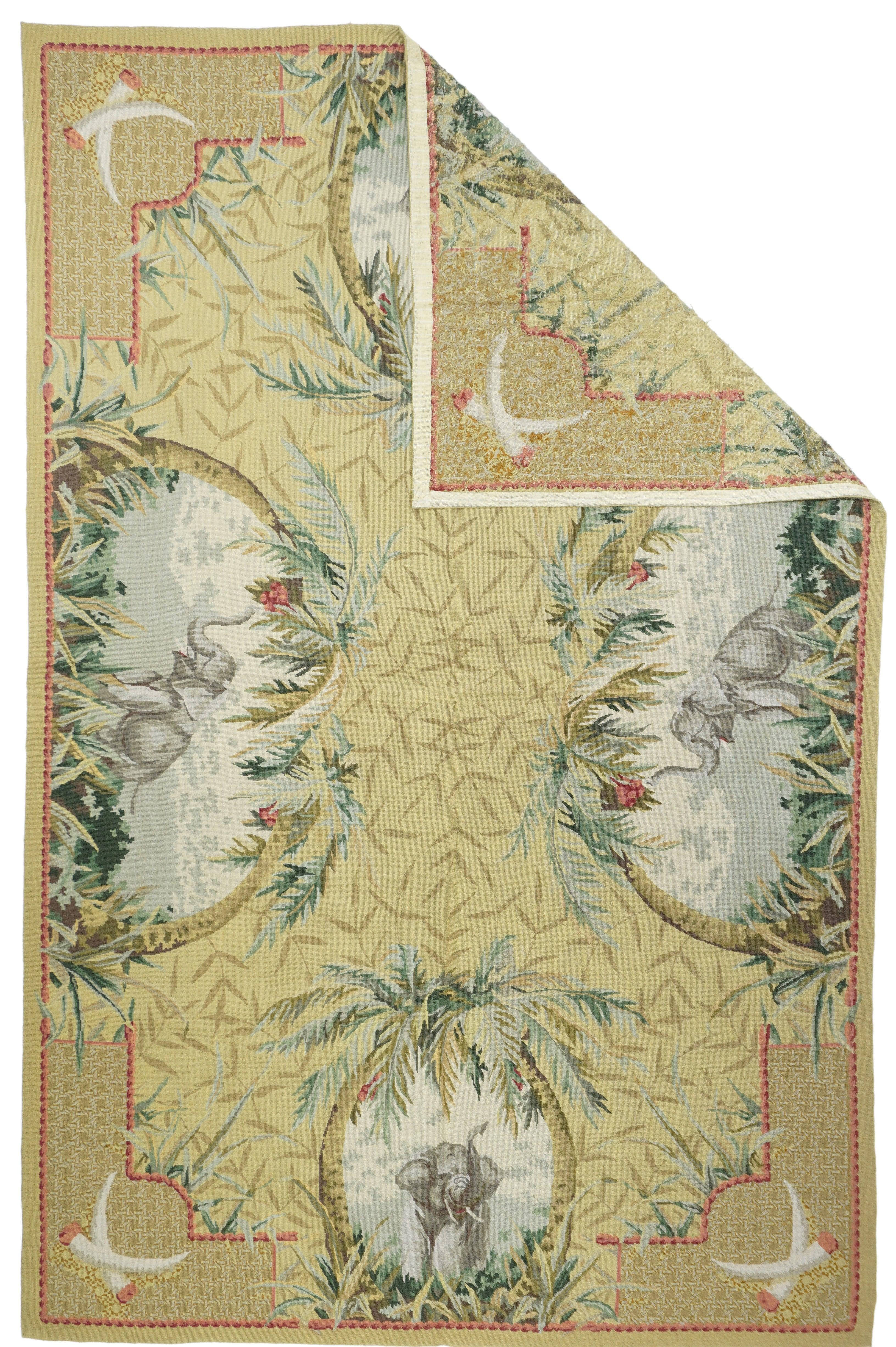 Tappeto Aubusson francese 5'10'' x 9'1''... Il campo quasi nero esplode con sei grandi tondi di fiori tropicali e foglie giganti che racchiudono uccelli colorati; e due riserve più piccole che racchiudono vignette di paesaggi tropicali. Le palme