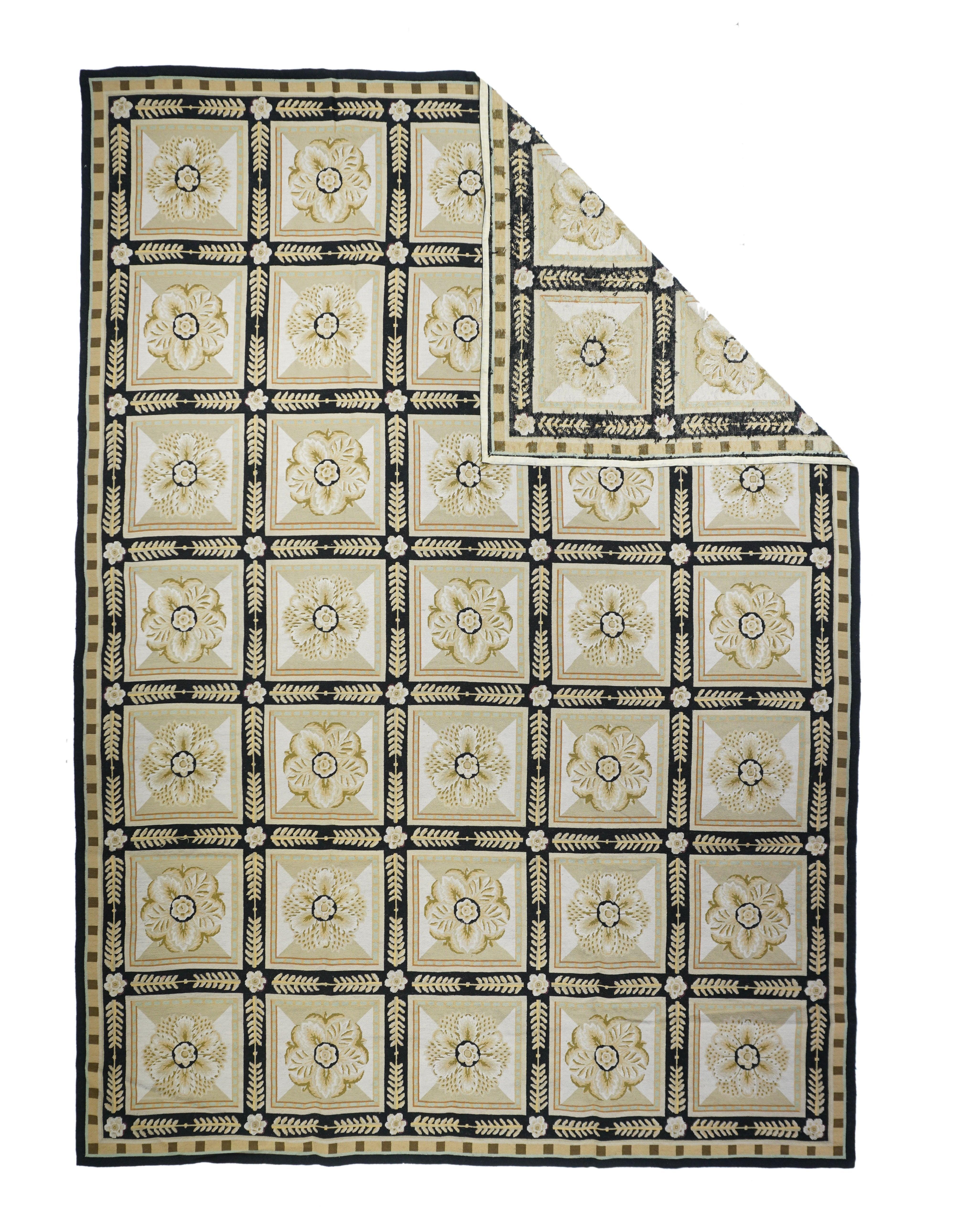 French Aubusson Design Rug 8'10'' x 12'1''. The near black field explodes with six large tropical flower and giant leaf roundels enclosing colorful birds; and two smaller end reserves enclosing tropical scenery vignettes. Palm trees float in the