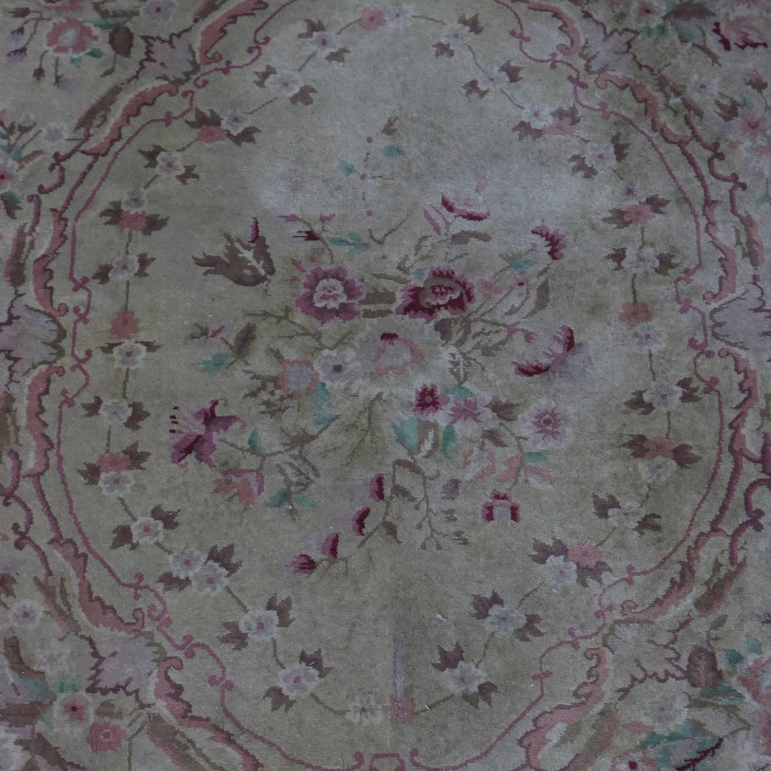 French Aubusson style wool rug features centre medallion with foliate, scroll and floral motif, 20th century

***DELIVERY NOTICE – Due to COVID-19 we are employing NO-CONTACT PRACTICES in the transfer of purchased items.  Additionally, for those who