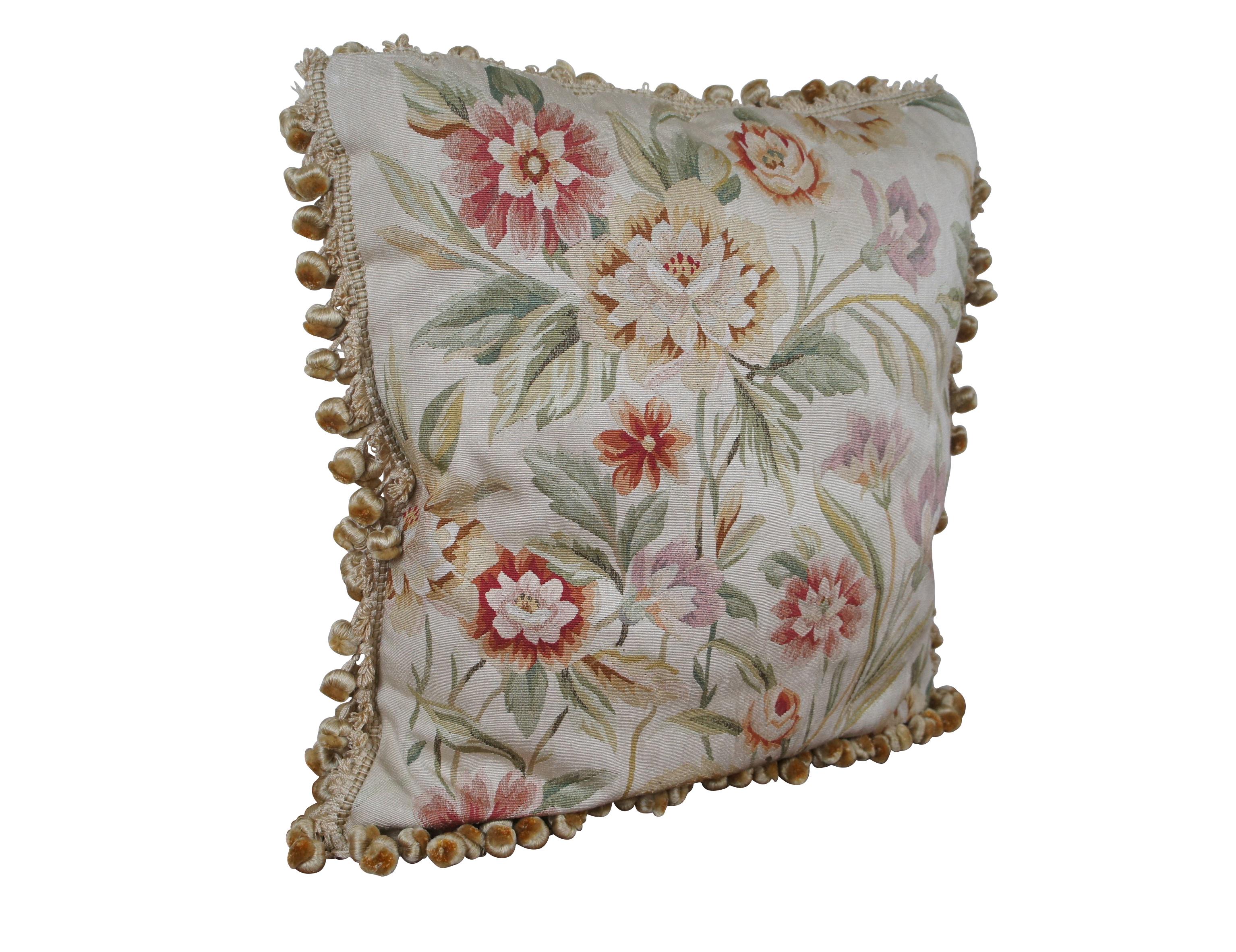 20th century French Aubusson style square throw pillow, embroidered in silk with and array of rust, cream, pink and purple flowers on leafy stems. Light beige ball tassel trim. Light brown velour back with zipper closure. Fiber