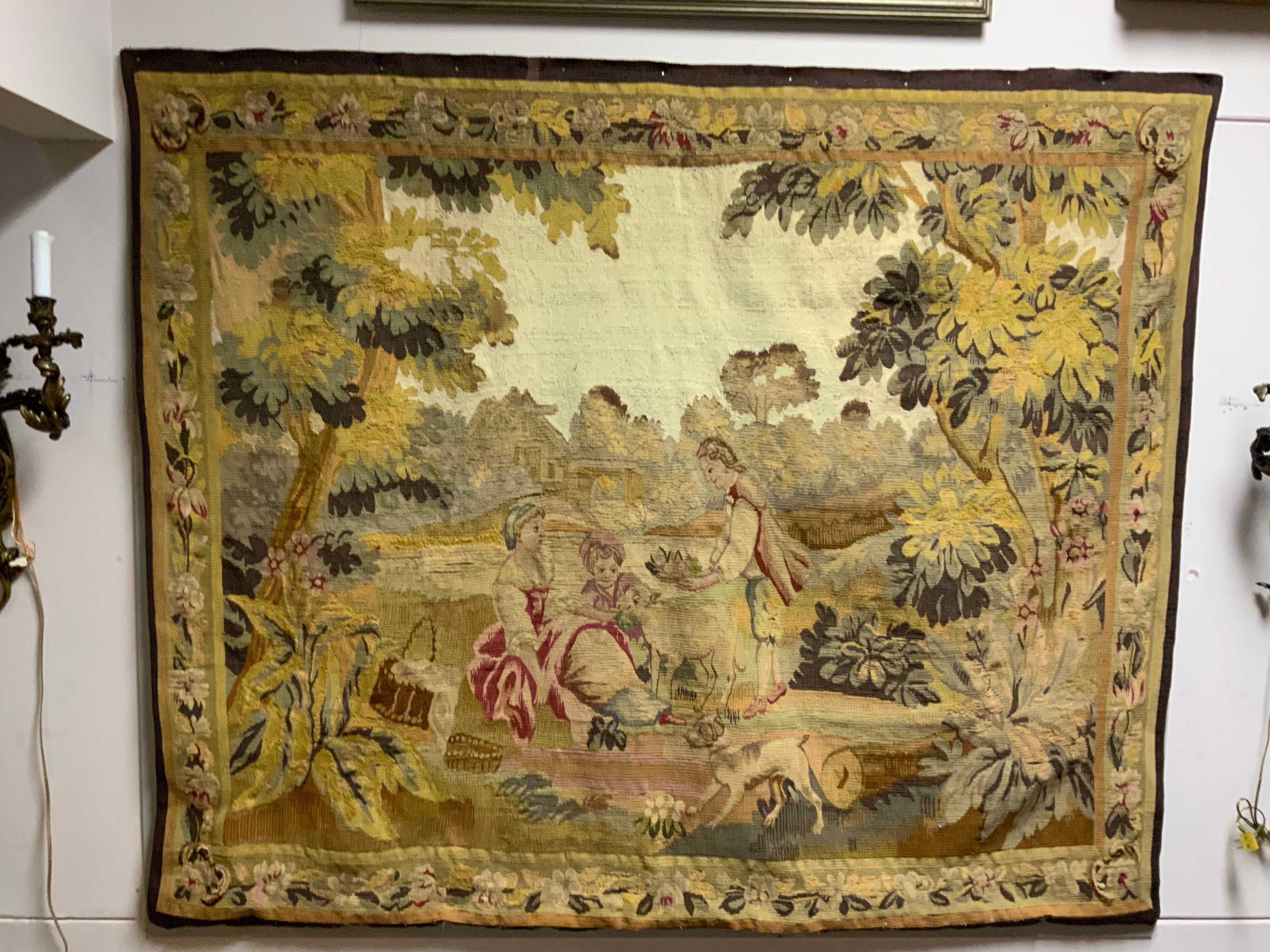 Hand woven Aubusson tapestry I. Neoclassical design
With a romantic couple with a tiny sheep. The hues
In this design are several shades of greens with 
A light rose color in the costumes of the couple.