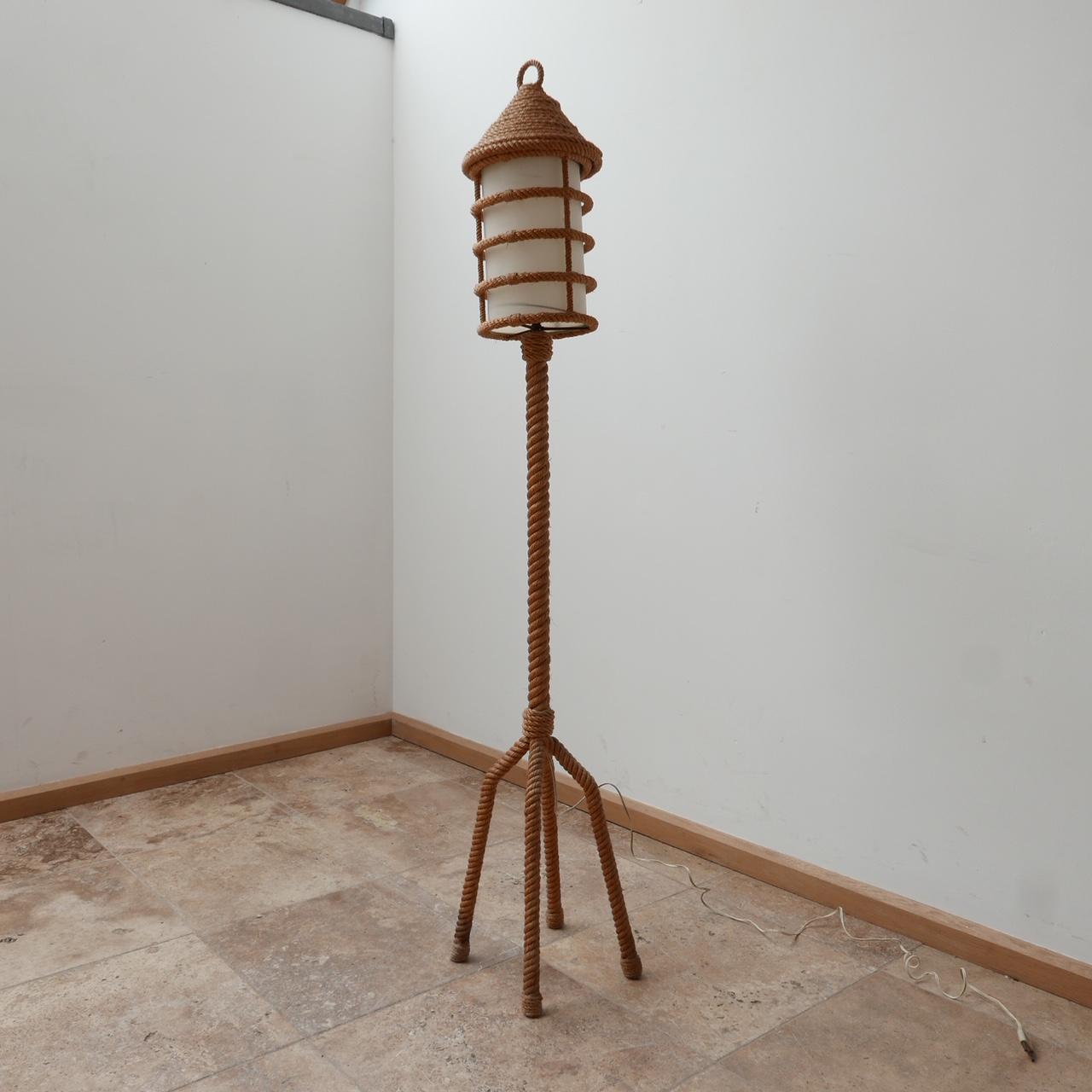 A floor lamp attributed to Audoux-Minet. 

France, c1960s. 

Rope work lamp, with original shade. 

Some wear commensurate with age but generally good condition. 

Dimensions: 114 H x 24 W x 24 D in cm.

Delivery: POA.

