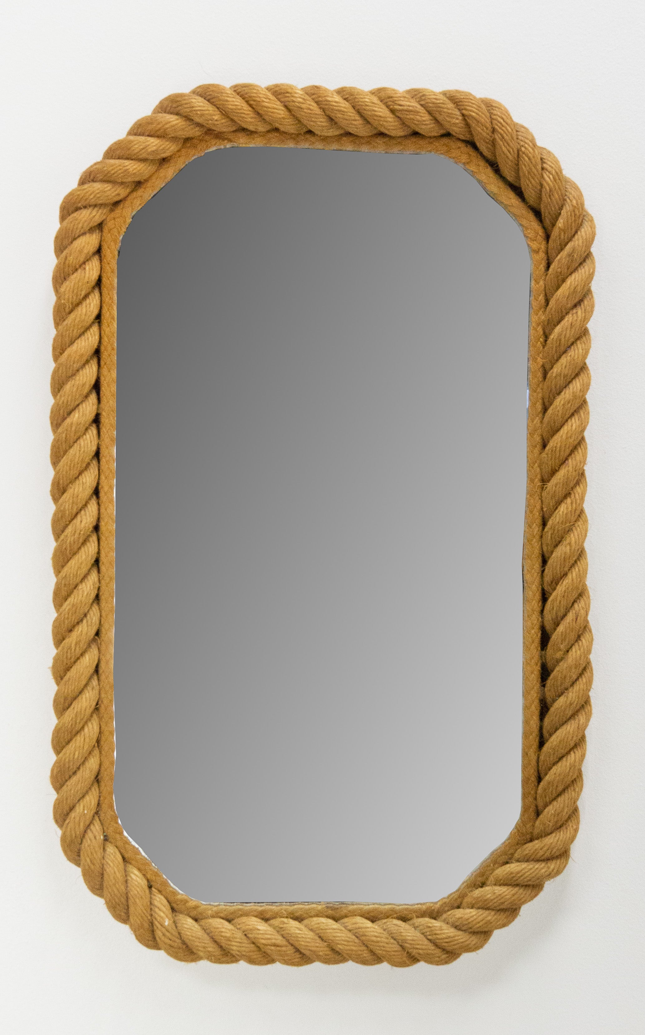 French Rectangular wall mirror from Adrien Audoux and Frida Minet.
This Franco-Swiss couple wanted to make art with everyday objects from simple materials. They were in opposition to Art Deco, which used luxurious materials. Their goal was also to
