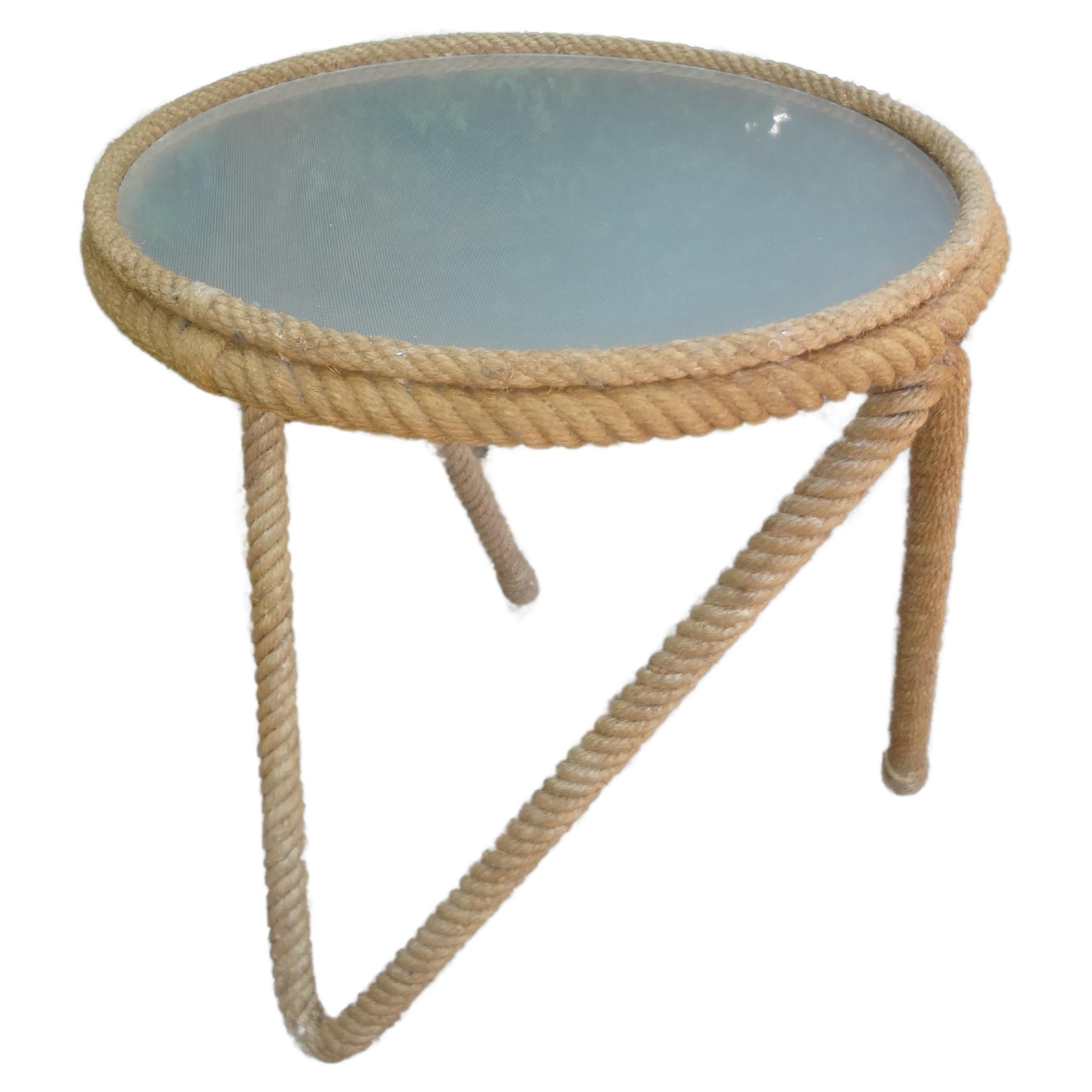 French Audoux & Minet Rope And Glass Table.
This handsome French rope table or gueridon by Adrien Audoux And Frida Minet was realized in the 1950's with the most unusual design featuring three legs and a frosted glass top. Our rare Audoux & Minet