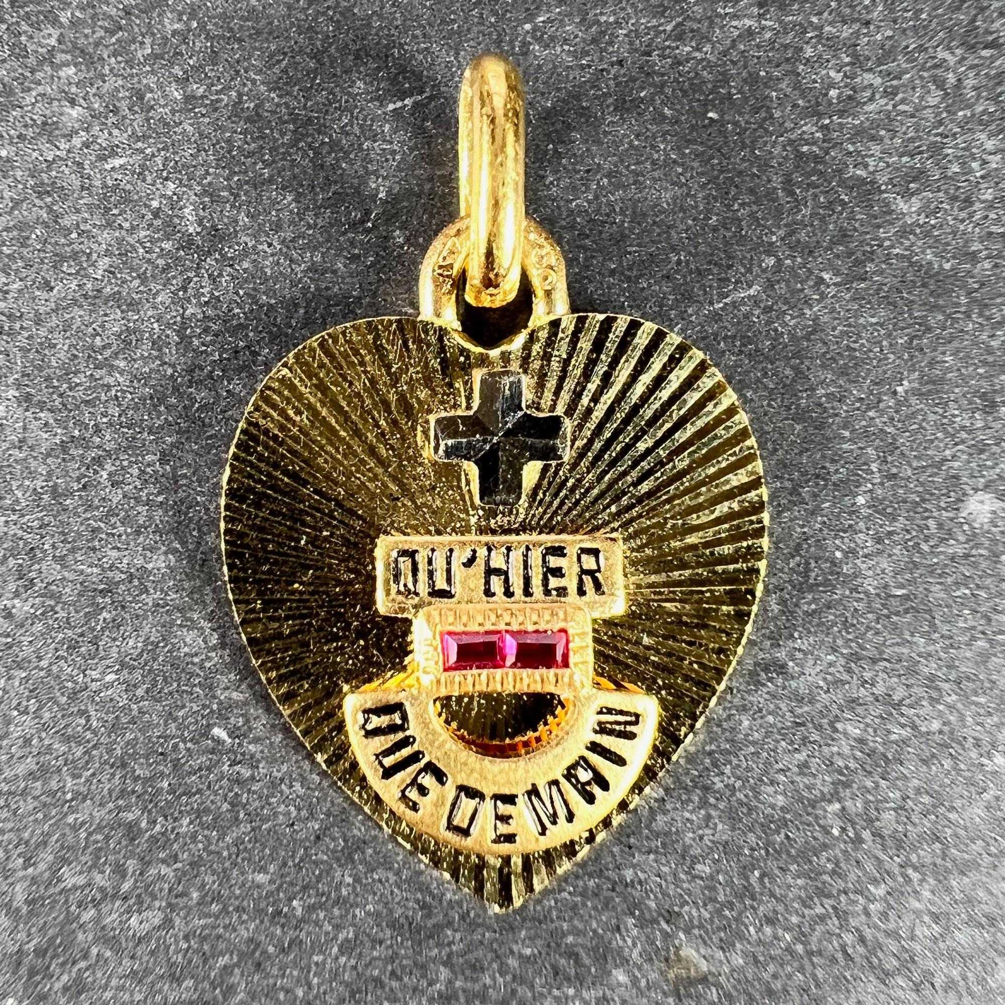 A French 18 karat (18K) yellow and white gold, enamel and ruby love charm pendant with a rebus spelling out 