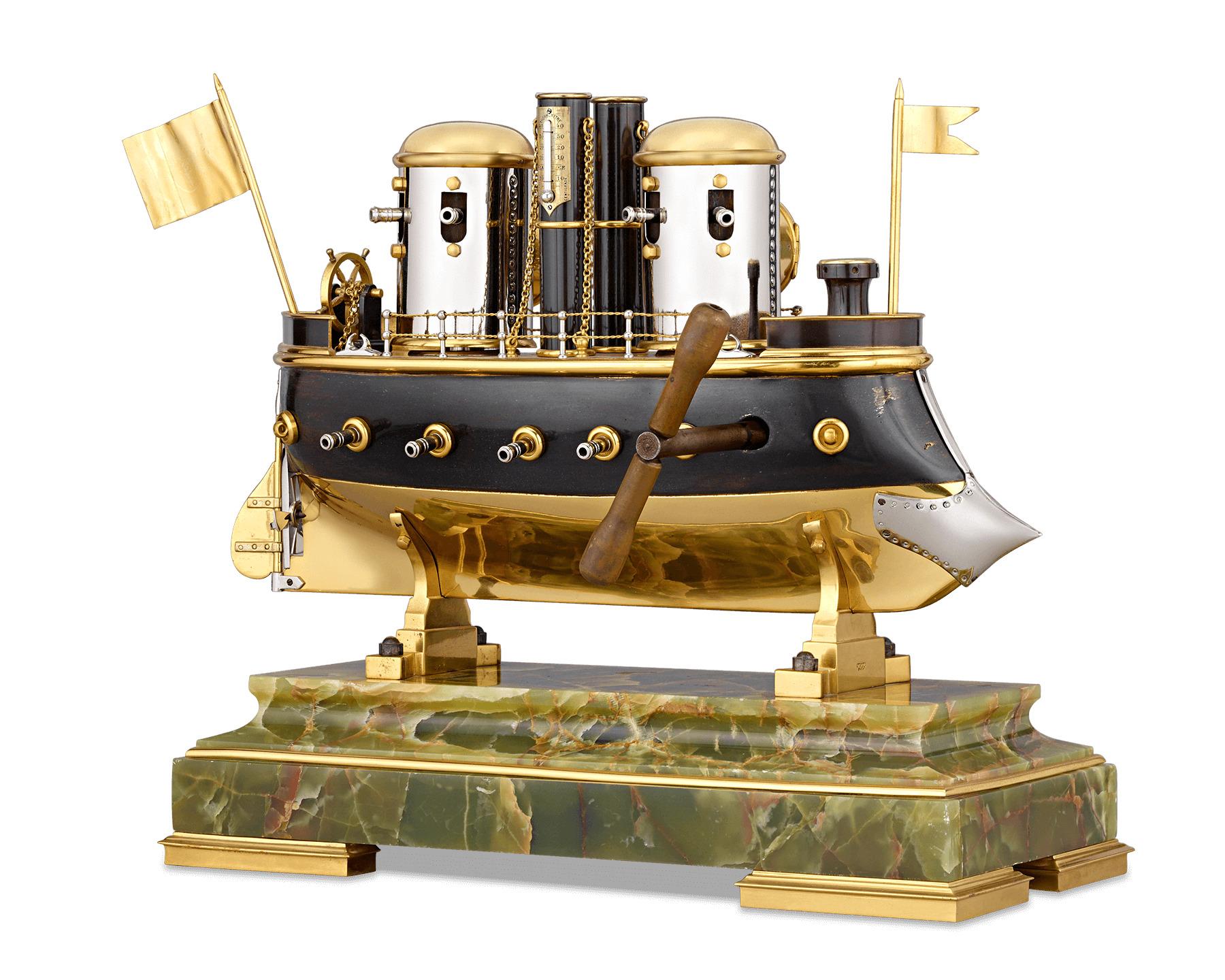 This automaton battleship clock is an impeccable example of the complex artistry of Industrial timepieces. An automaton is incorporated into the ship's form, with a separate mechanism that causes the propeller to spin and turrets to rotate 360