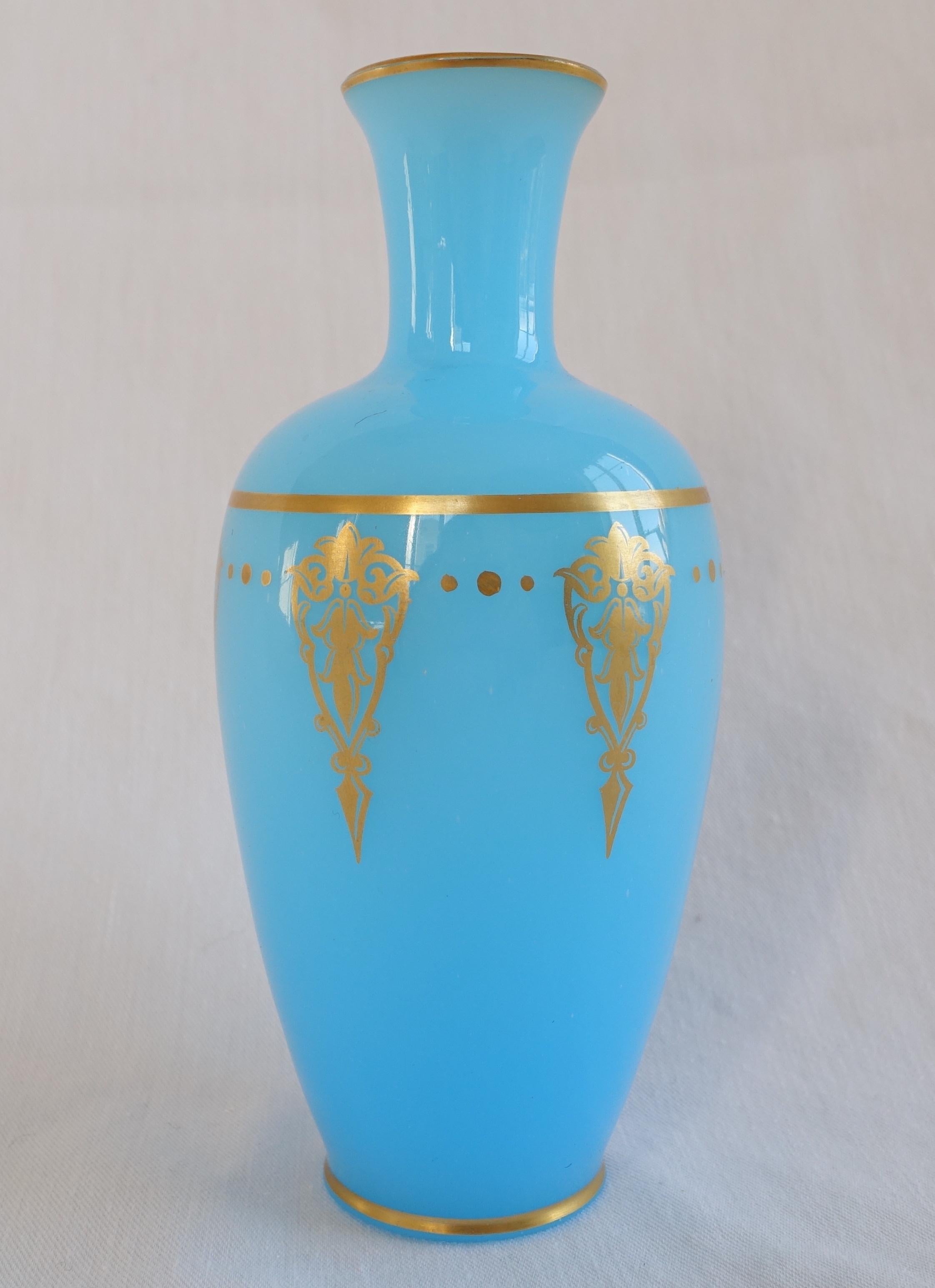 Rare Baccarat opaline crystal vase - single flower vase, beautiful light blue opaline enhanced with a fine gold gilt Empire style pattern.

Baccarat signature is stamped on the base (standard signature surrounded by 