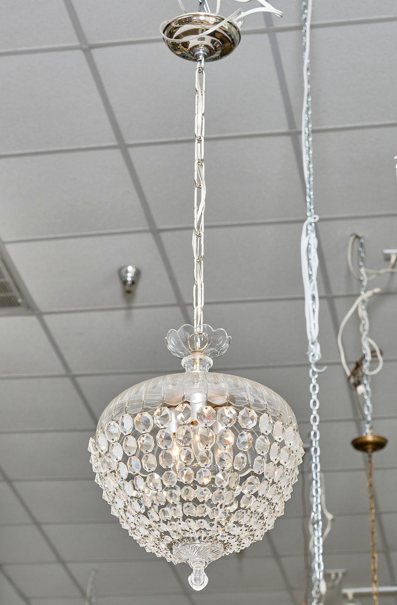 Chandelier from France made of crystal in the typical bell shape by Baccarat. This piece has been newly wired to fit US standards.
