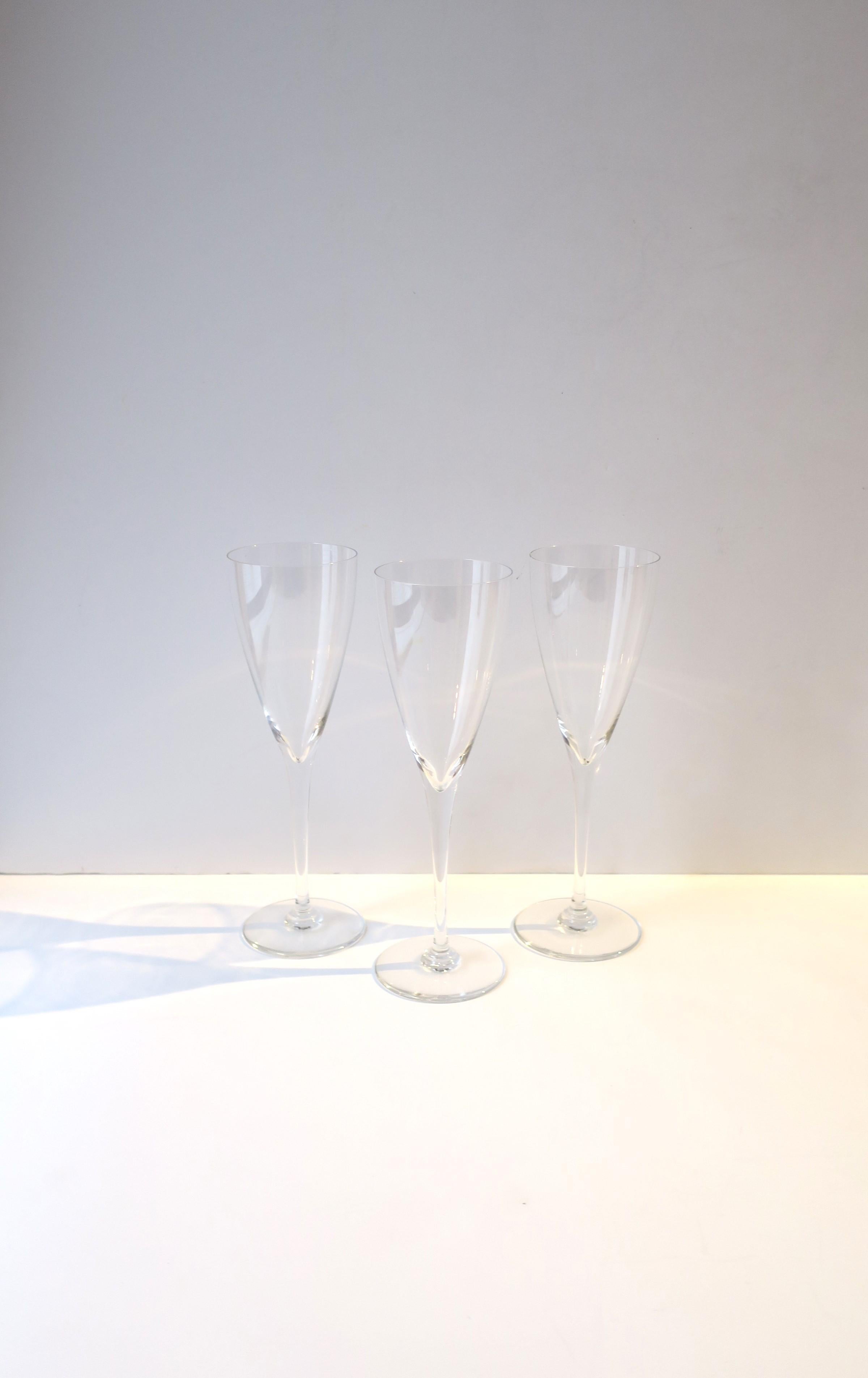 A beautiful set for three (3) French crystal Champagne flutes glasses from luxury Maison, Baccarat, circa late-20th century, France. With markers' acid mark on bottom of all three, 'Baccarat', 'Made in France.' A beautiful set for everyday use, any