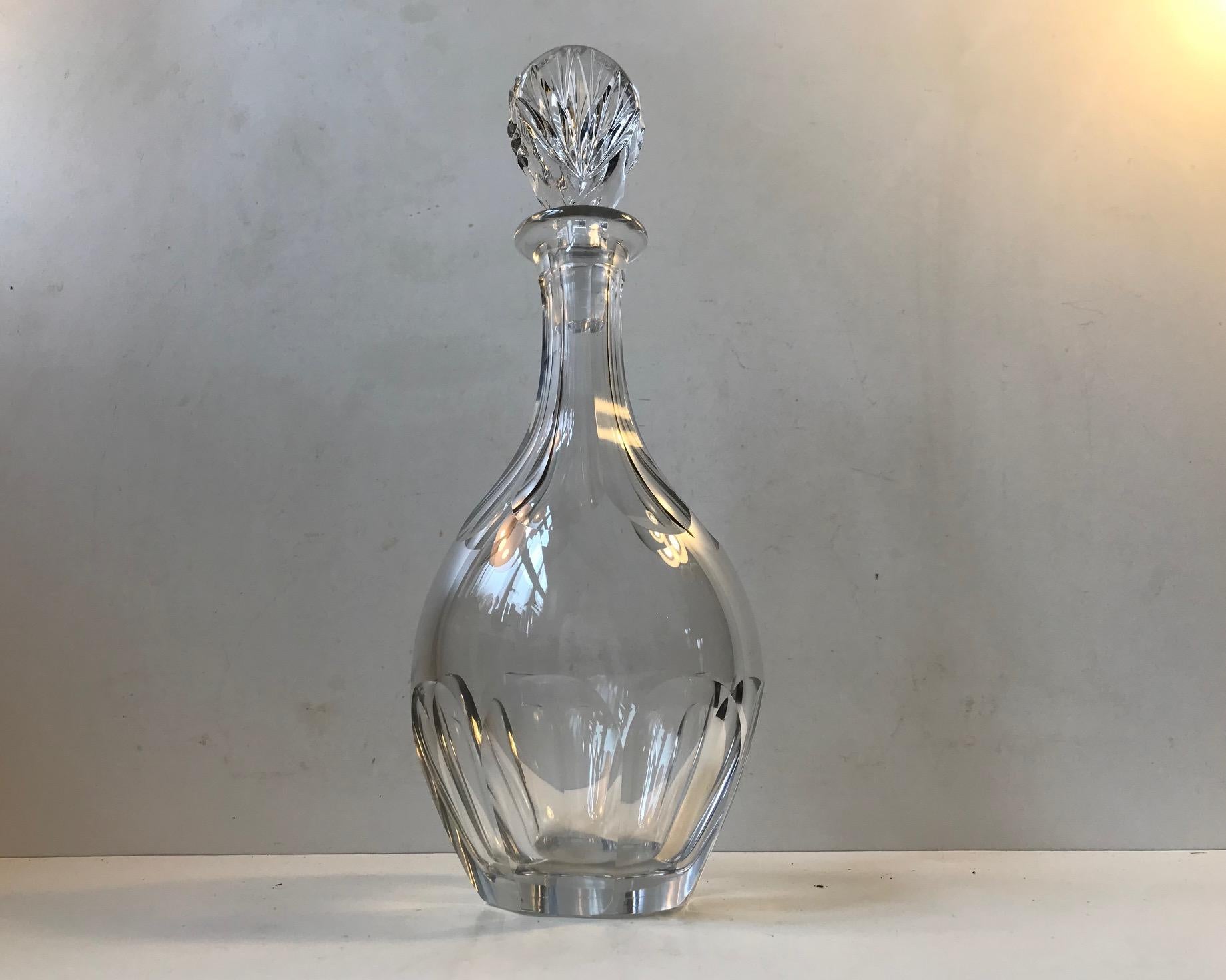 crystal de Lorraine has an inheritance that goes back all the way to 1764. They have created crystal ware for names like Hermés, Cartier and St Dupont. This decanter dates to the 1950s or 1960s. All the cut edges are beveled softly. It can contain