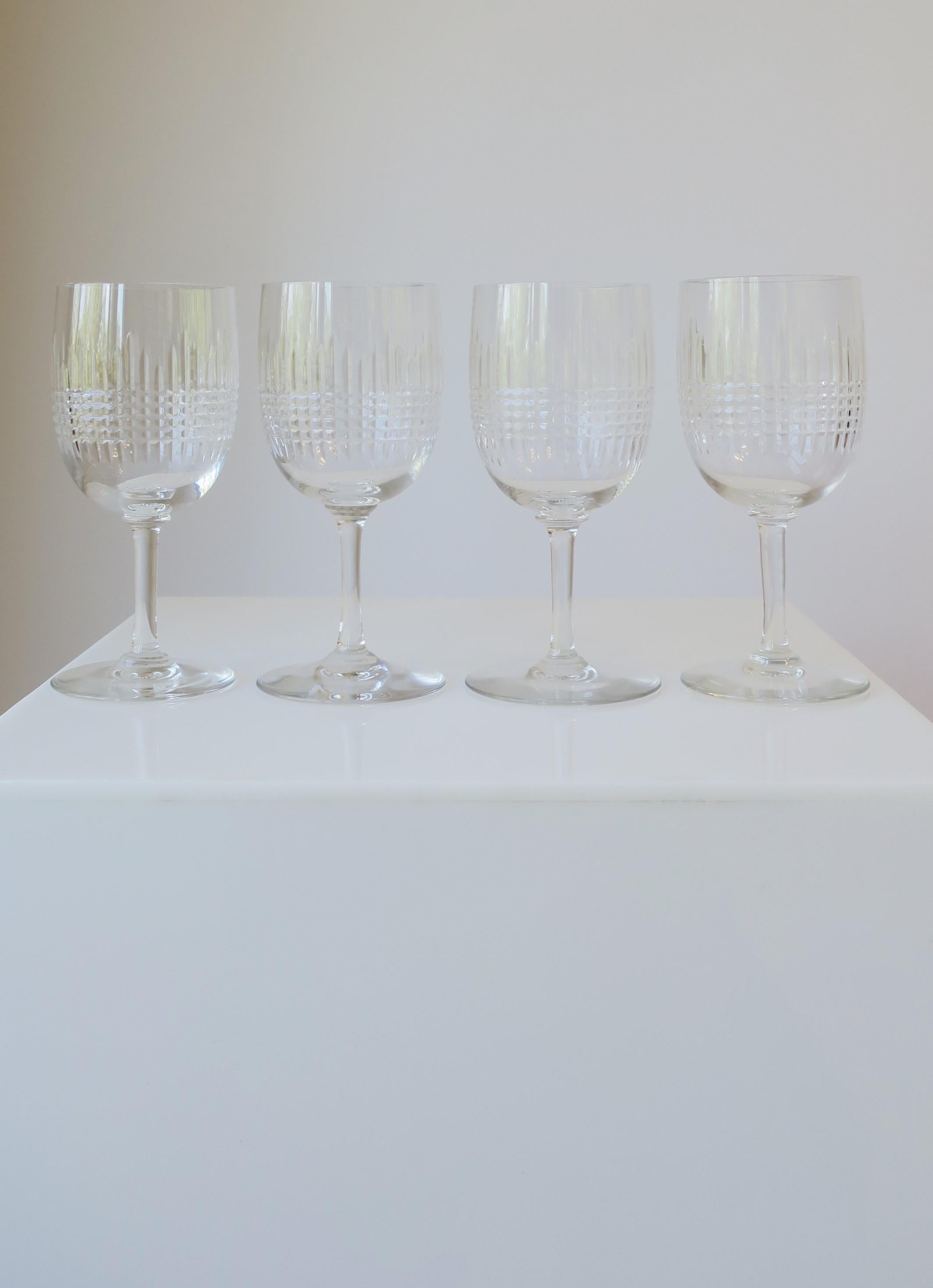 
**There are 2 sets of four (4) available for purchase.

A beautiful set of four (4) cut crystal wine, water or cocktail glasses from French luxury house Baccarat, circa late-20th century, France. In the 'Nancy' pattern. All marked on bottom with