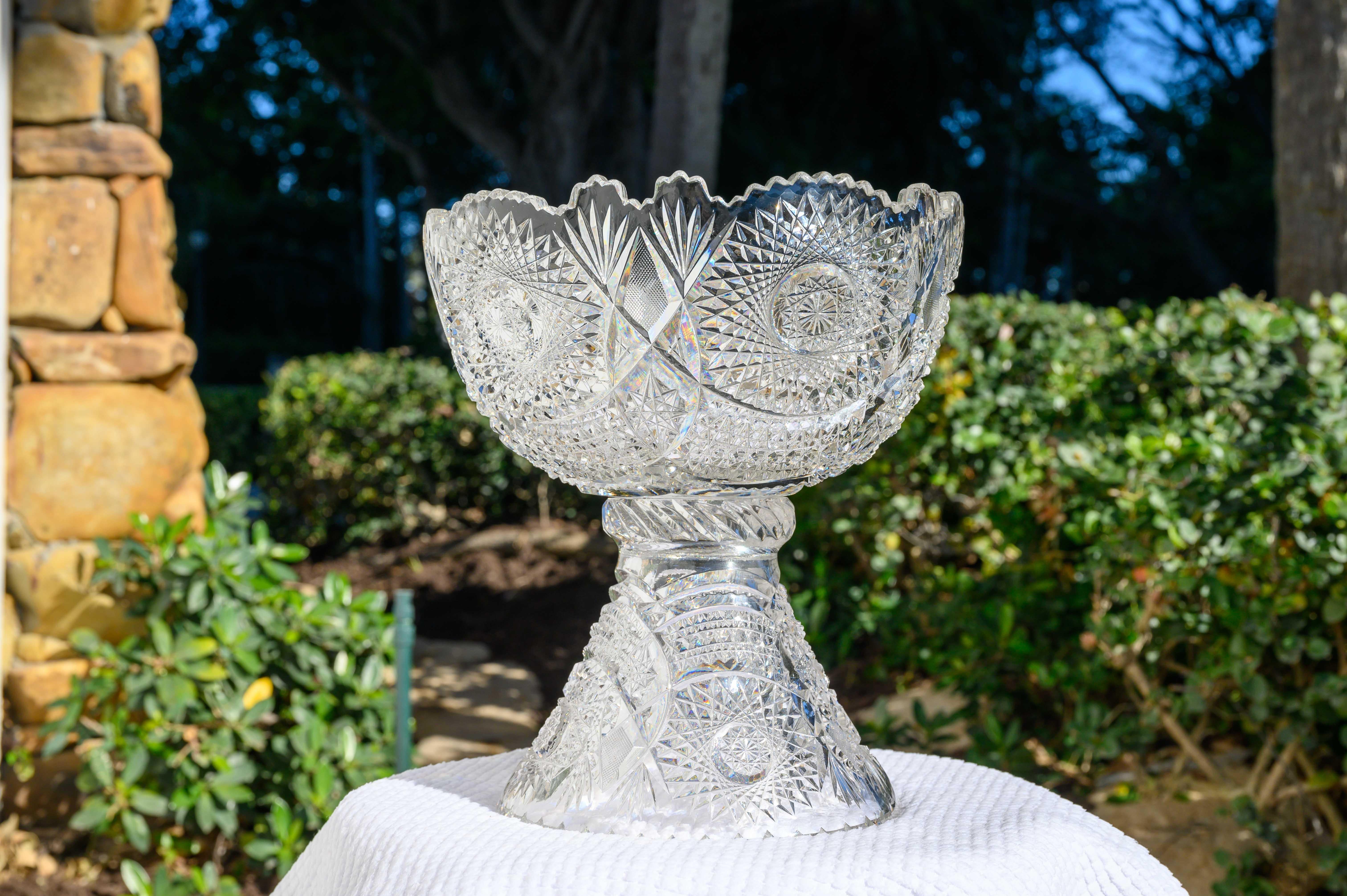 A crystal masterpiece of exceptional proportions, this finely cut crystal footed bowl or bowl on a pedestal exemplifies extraordinary craftsmen. The deep diamond-cut bevels produce infinite reflections as shown in the images that we photographed in