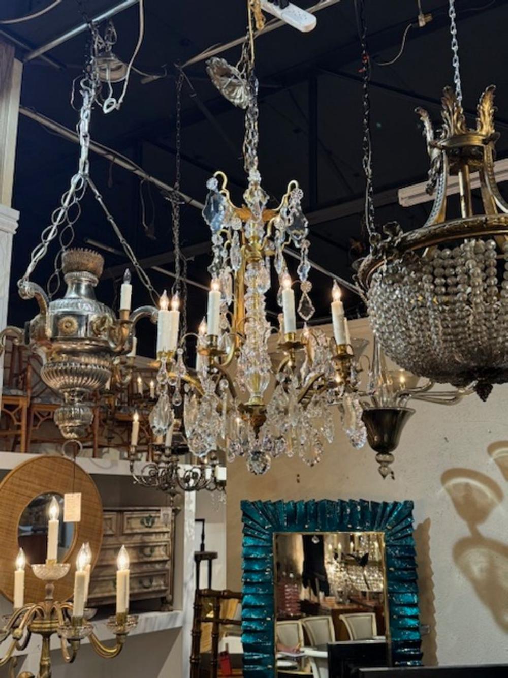 Late 19th century French Baccarat manner crystal and gilt bronze 9-light chandelier. Circa 1890. The chandelier has been professionally rewired, comes with matching chain and canopy. It is ready to hang!