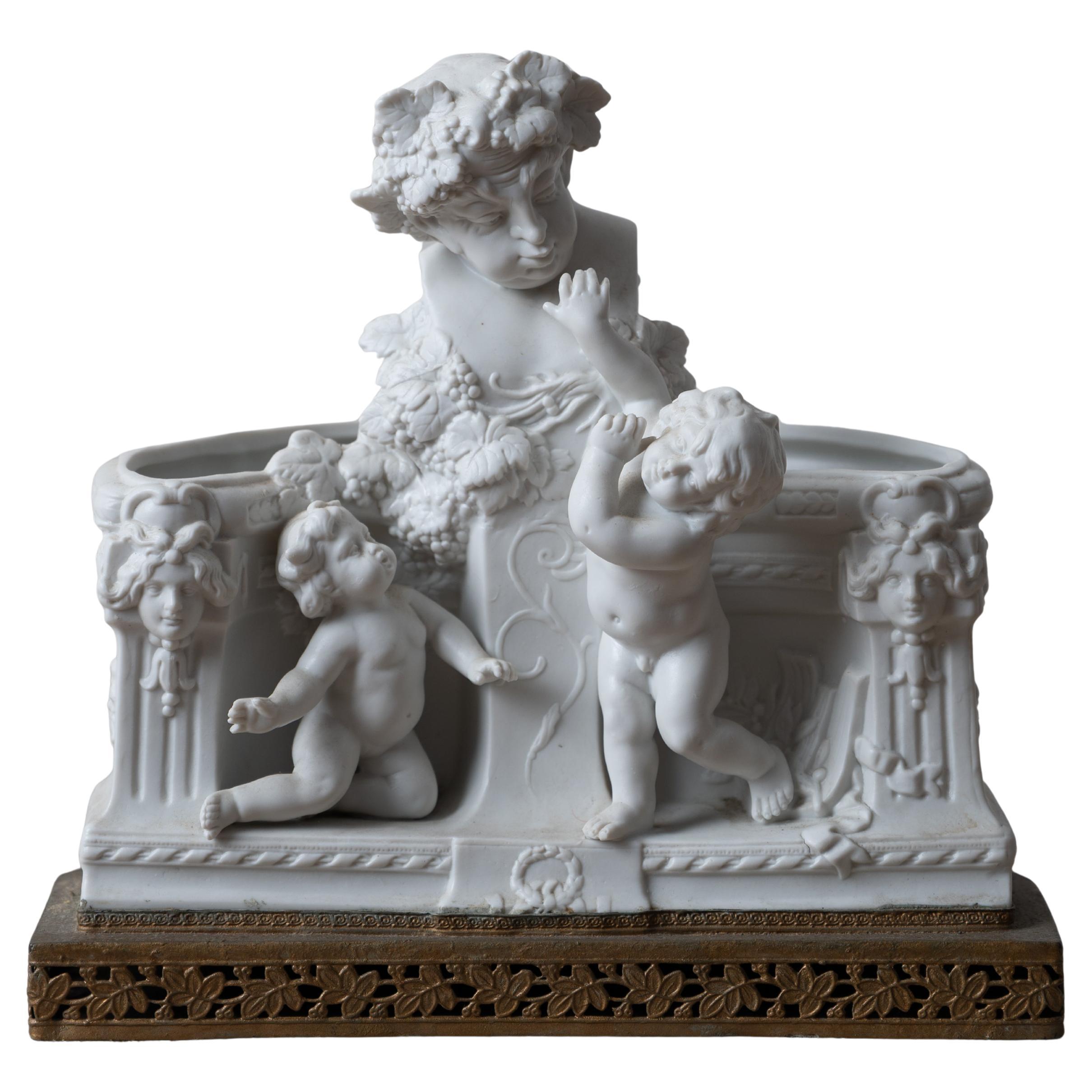 French Bacchus & Putti Bisque Jardiniere For Sale