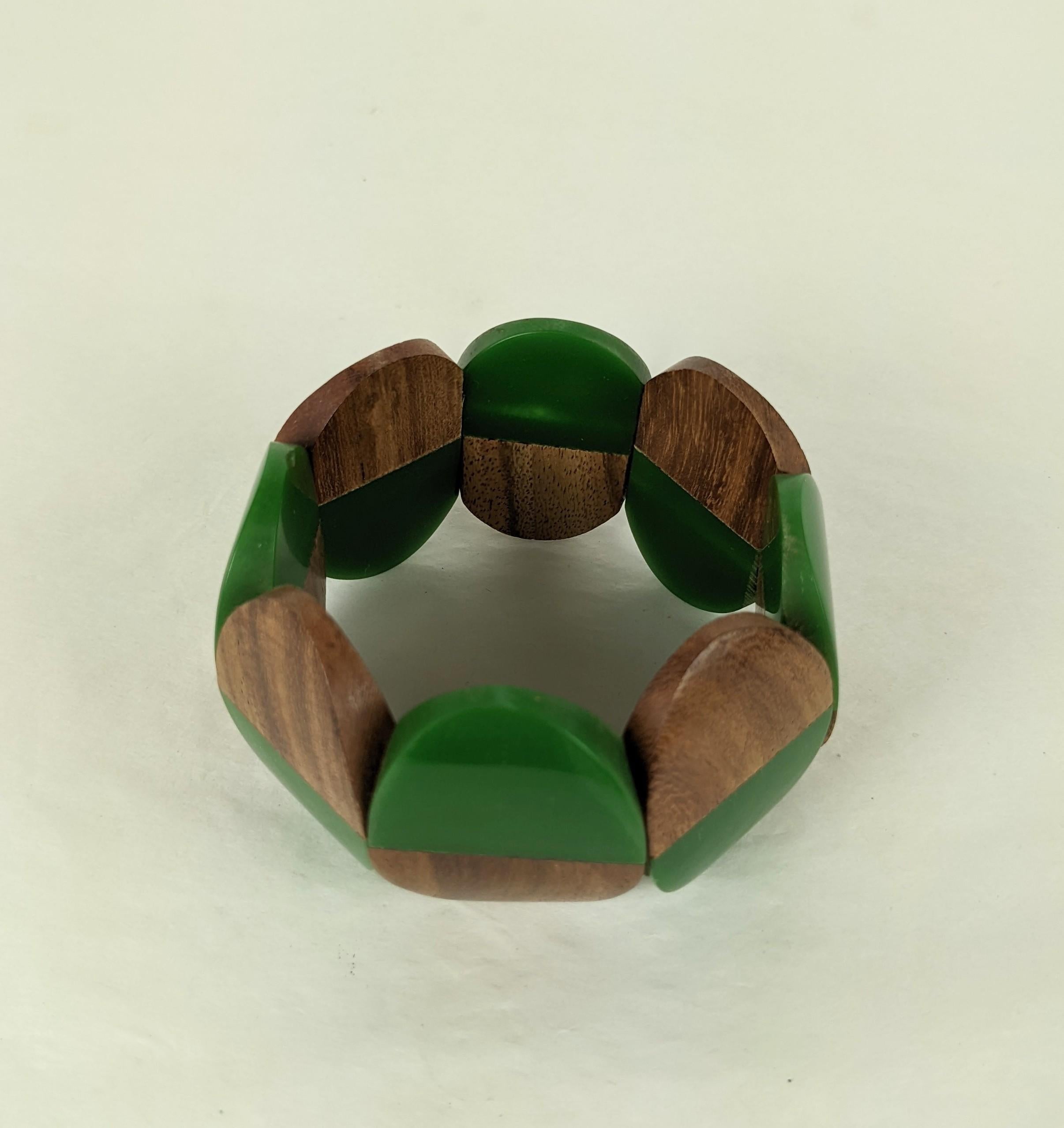 Striking Art Deco French Bakelite and Exotic Wood Laminated Stretch Bracelet from the 1940's. Strung on 2 elastic cords.  1.75