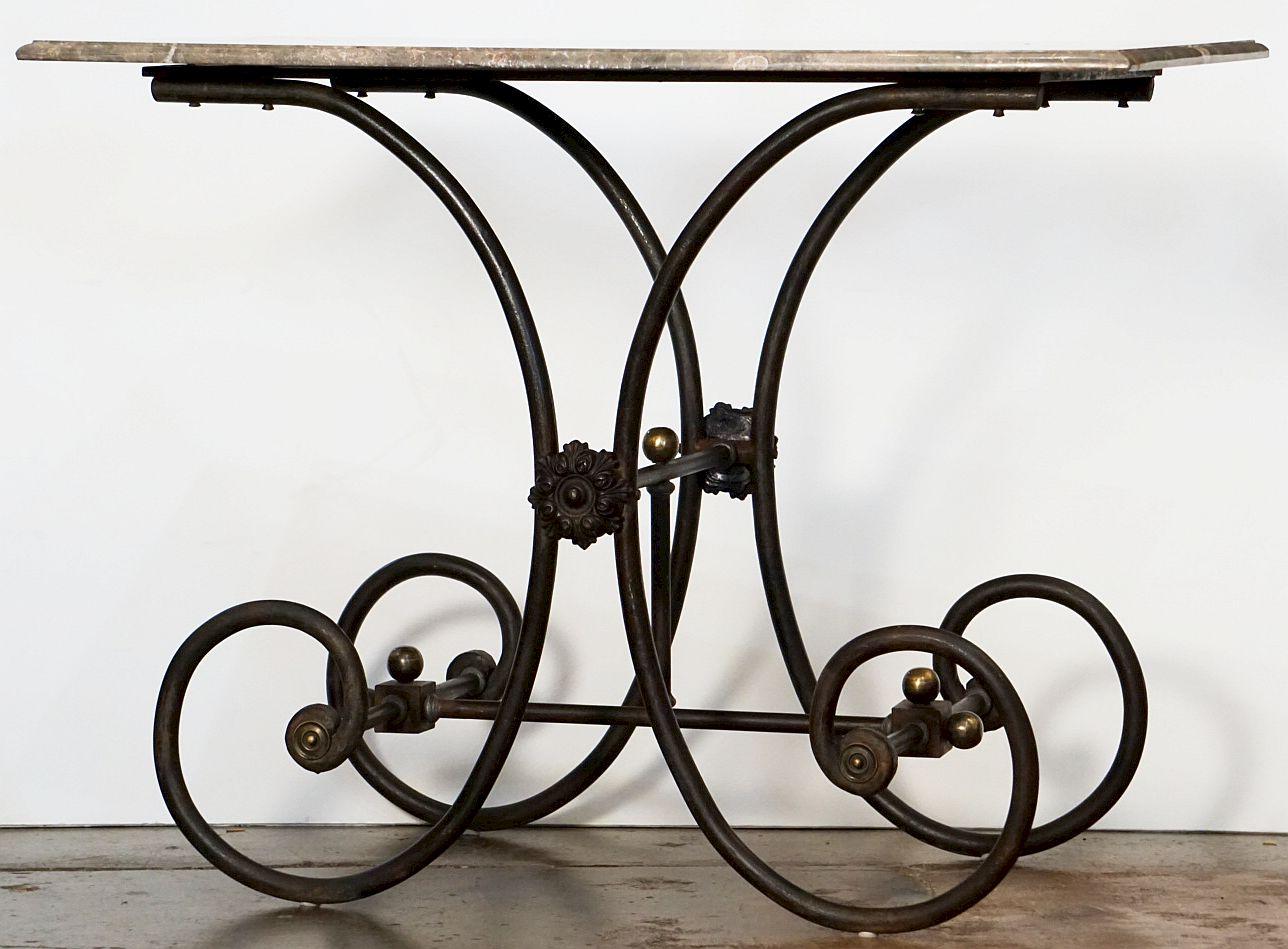 A fine French bakery patisserie or pastry maker's table from the late 19th century, featuring a rectangular figured marble top set upon a graceful wrought iron frame with brass accents.

Baker's tables were often used in exclusive hotels and