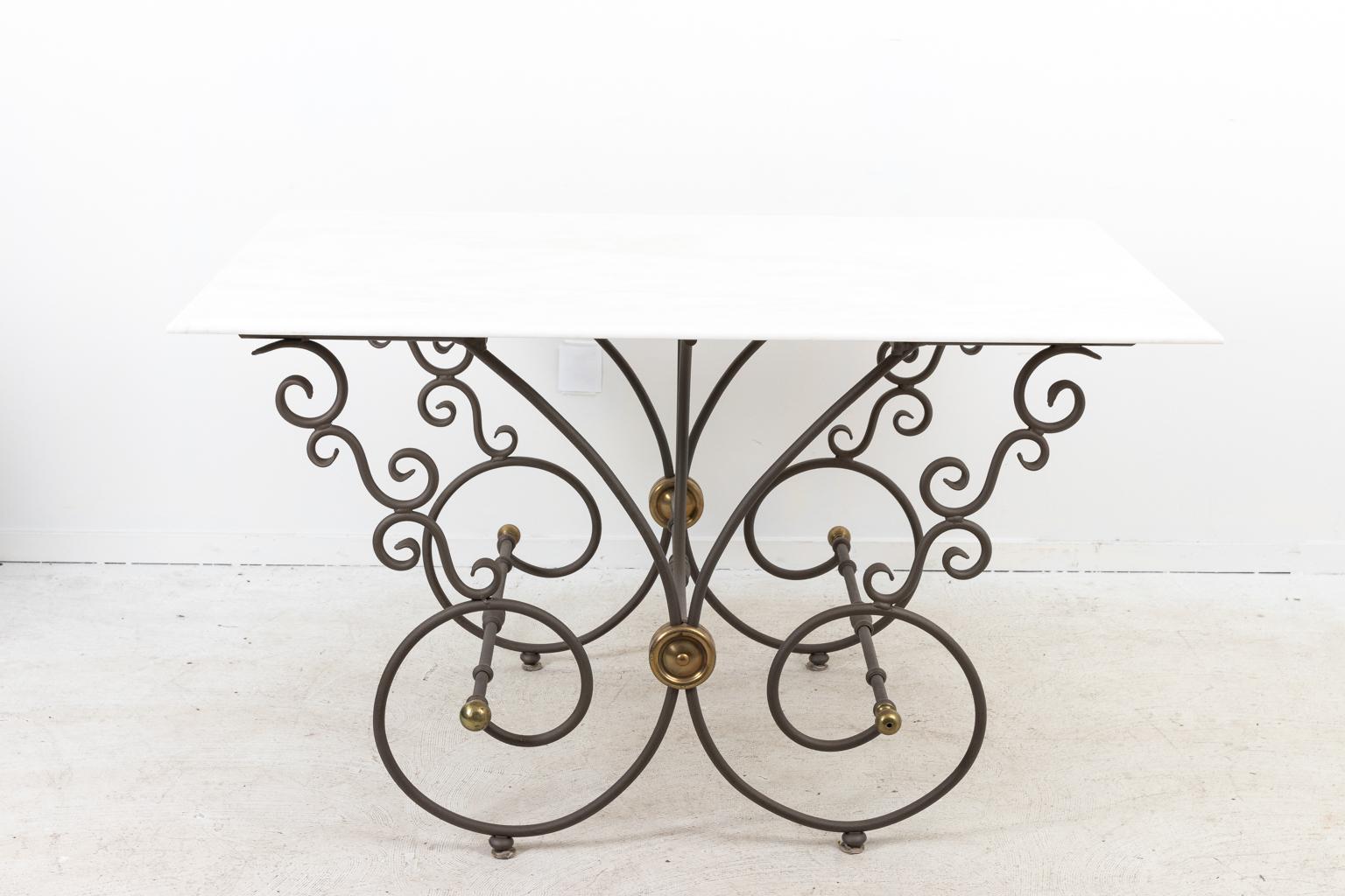 French baker's pastry table in French steel with new marble top, circa 1890s. The table is sand blasted and powder coated for outdoor use. Large size for kitchen island with brass accents. The table is also detailed with S-scroll and C-scroll shaped