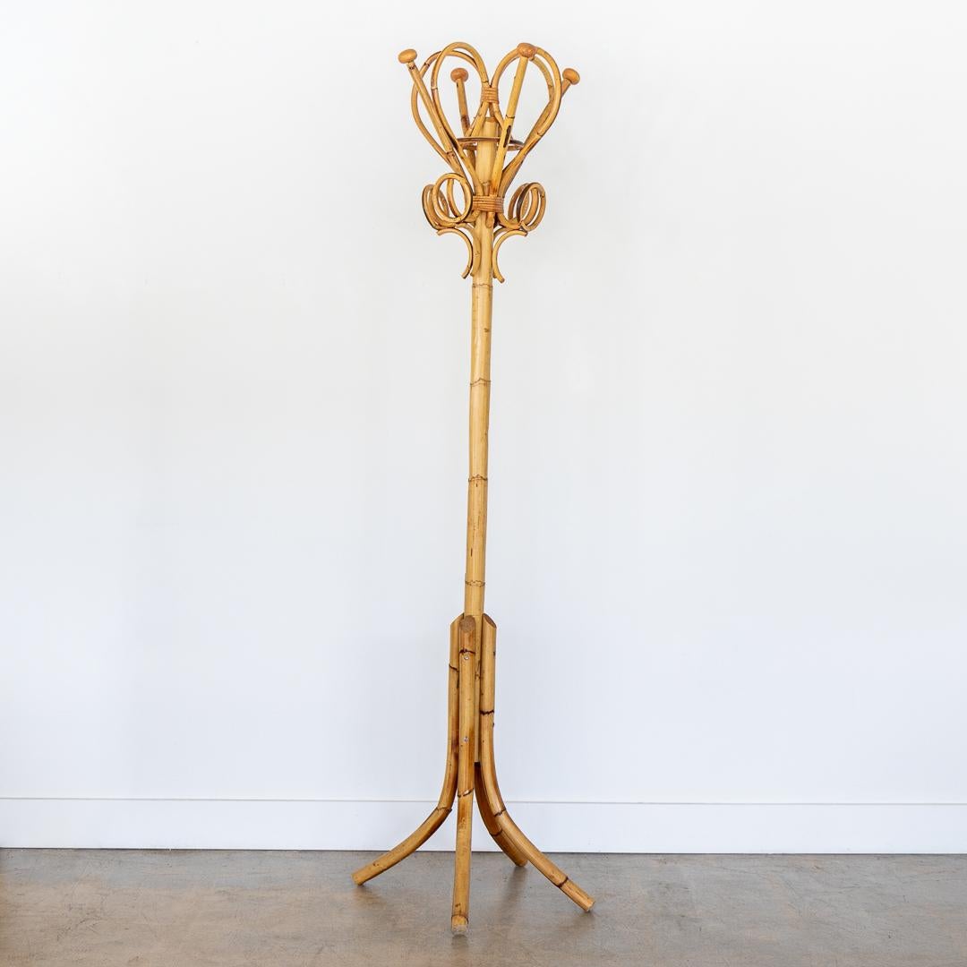 Beautiful vintage rattan and bamboo standing coat stand from France, 1960s. Four round circular hooks and four wood pegs wrapped in rattan with a long bamboo stem and four leg base. Perfect for a bedroom or entryway.



