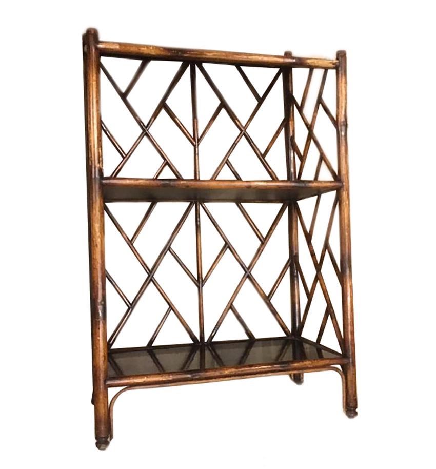 A circa 1940s French bamboo étagère with two shelves and inclined top.

Measurements:
Height (tallest side) 43