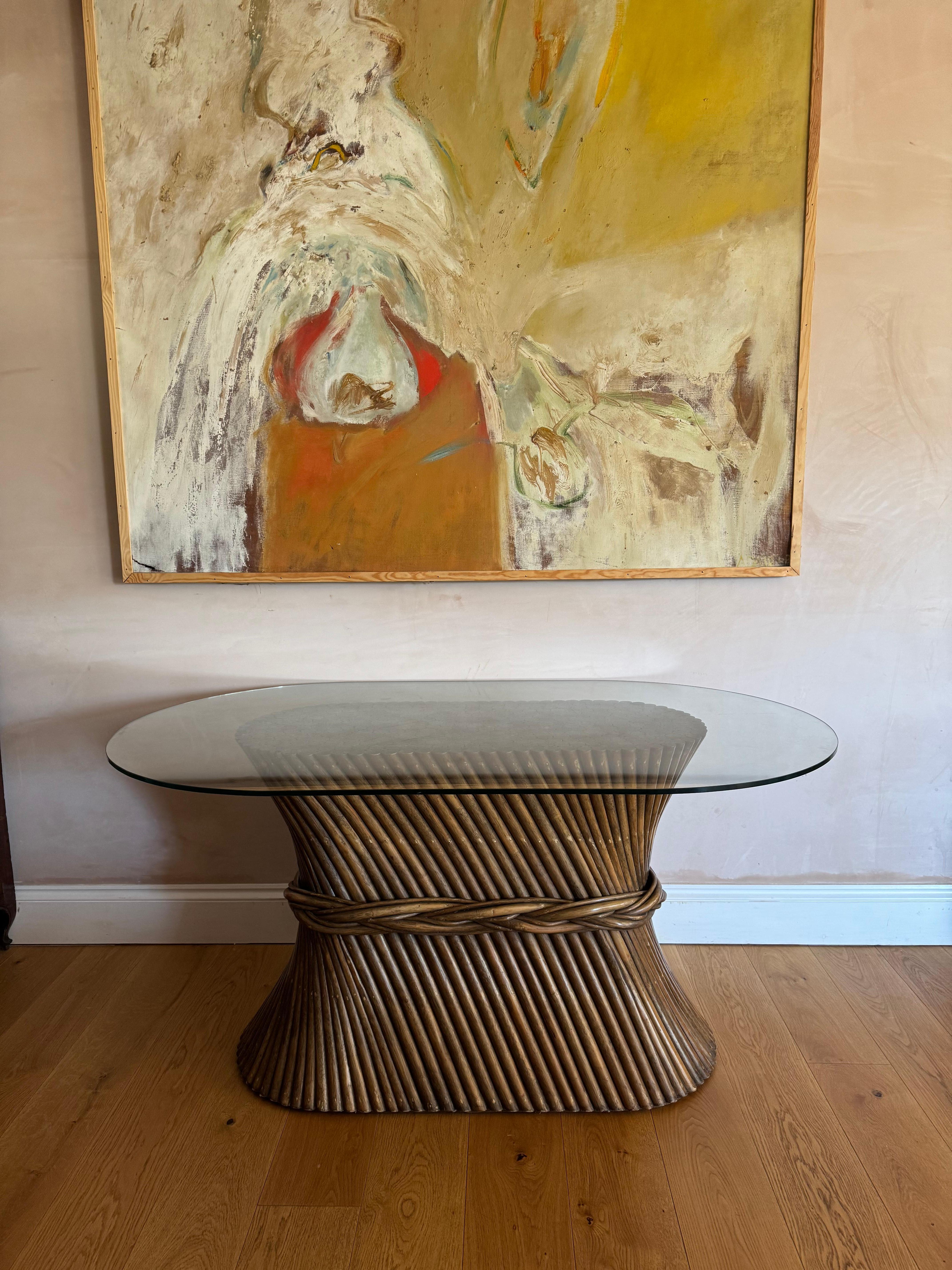 An elegant bamboo and glass topped dining table or console.