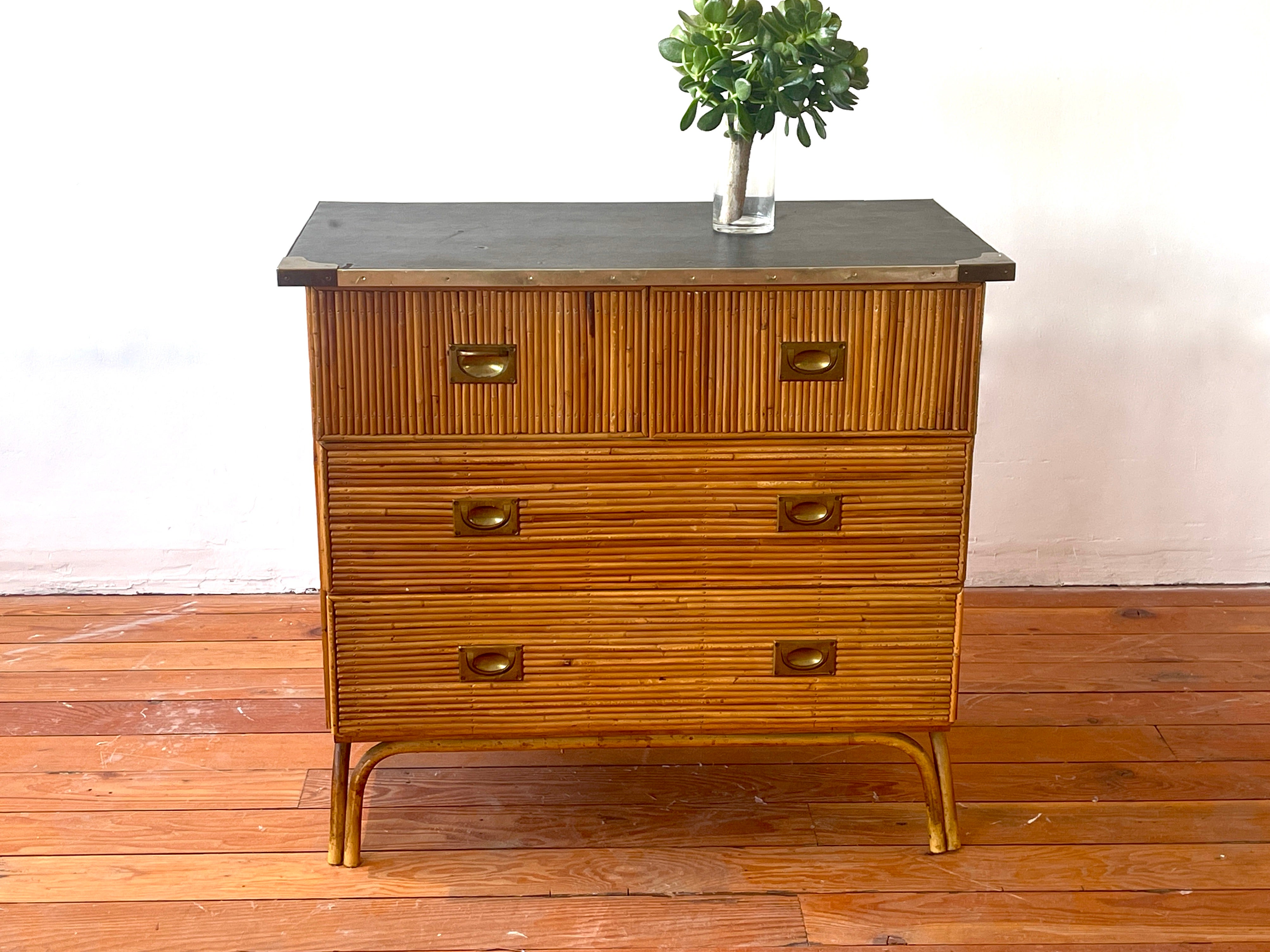 French bamboo dresser with brass accents and hardware and original skai leatherette top.
 