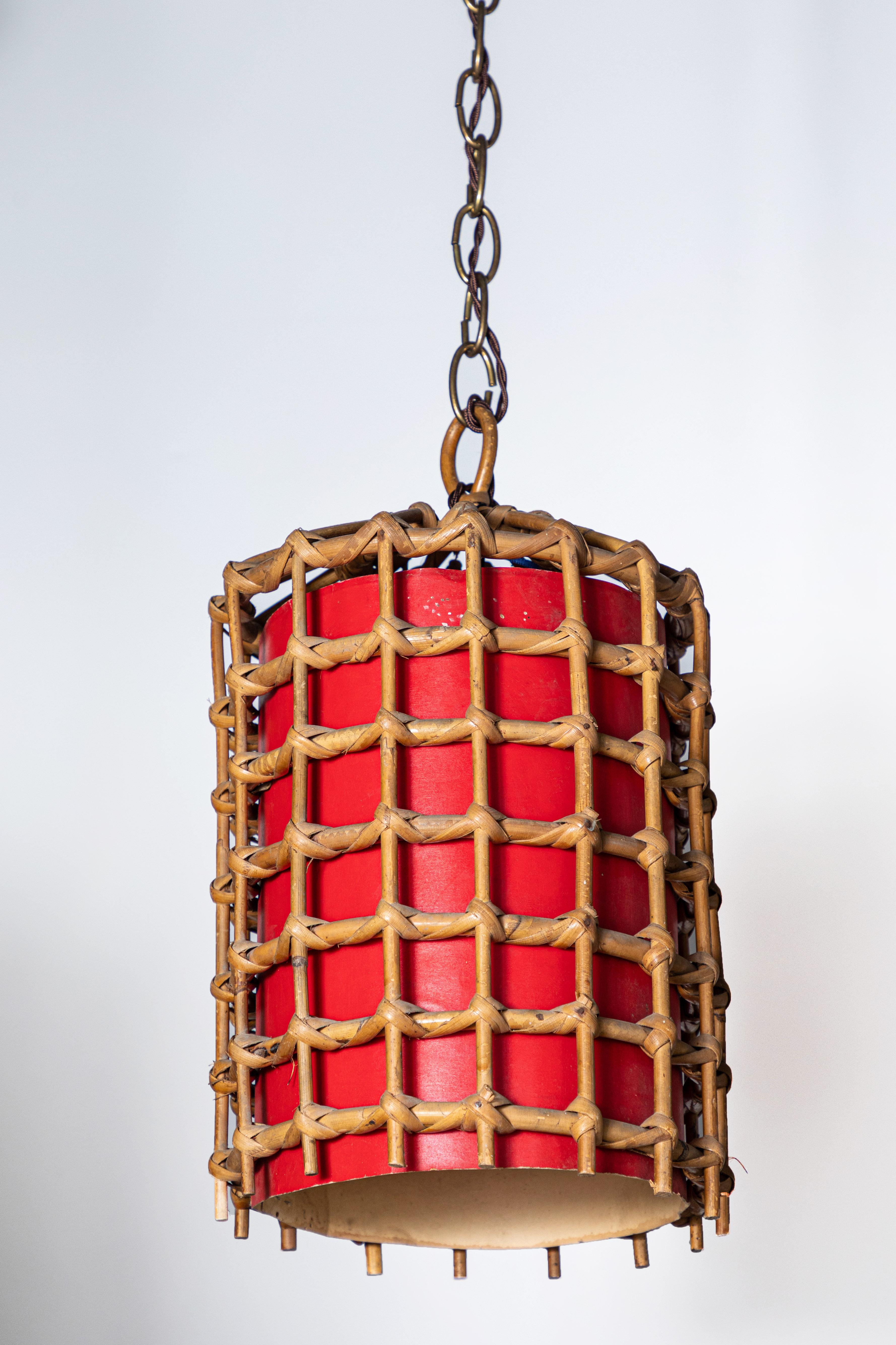 French bamboo lantern pendant with red illuminated paper, antique brass chain and brown twist cord added. The light has been newly wired and comes with a canopy. Lantern alone is 12