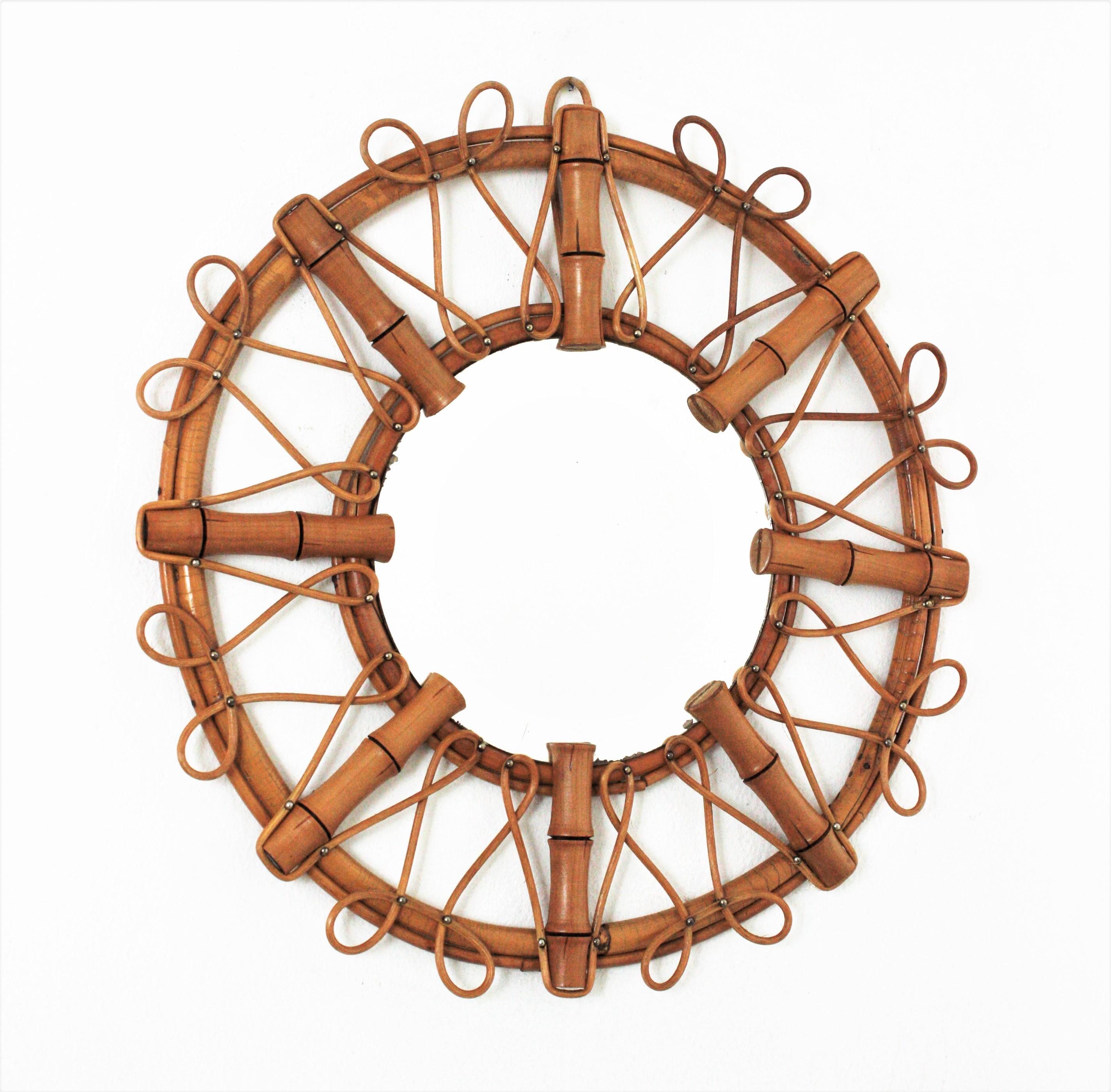 Eye-catching bamboo and rattan sunburst mirror with looped details. Handcrafted in France, 1960s.
This cool rattan wall mirror combines midcentury and chinoiserie accents. It has all the taste and freshness of the Mediterranean Coast.
This bamboo