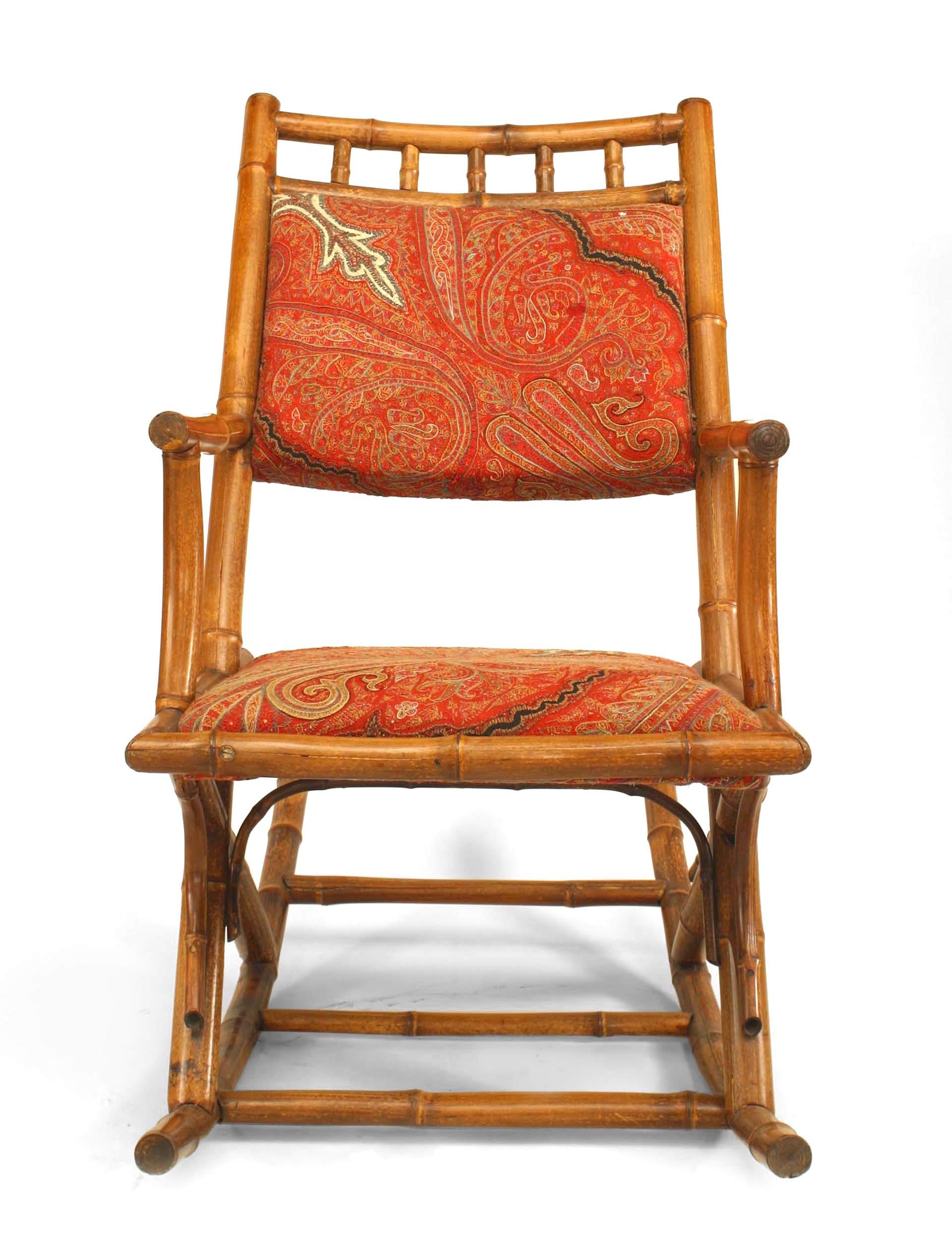 French Victorian bamboo rocking chair with paisley upholstered seat and back
