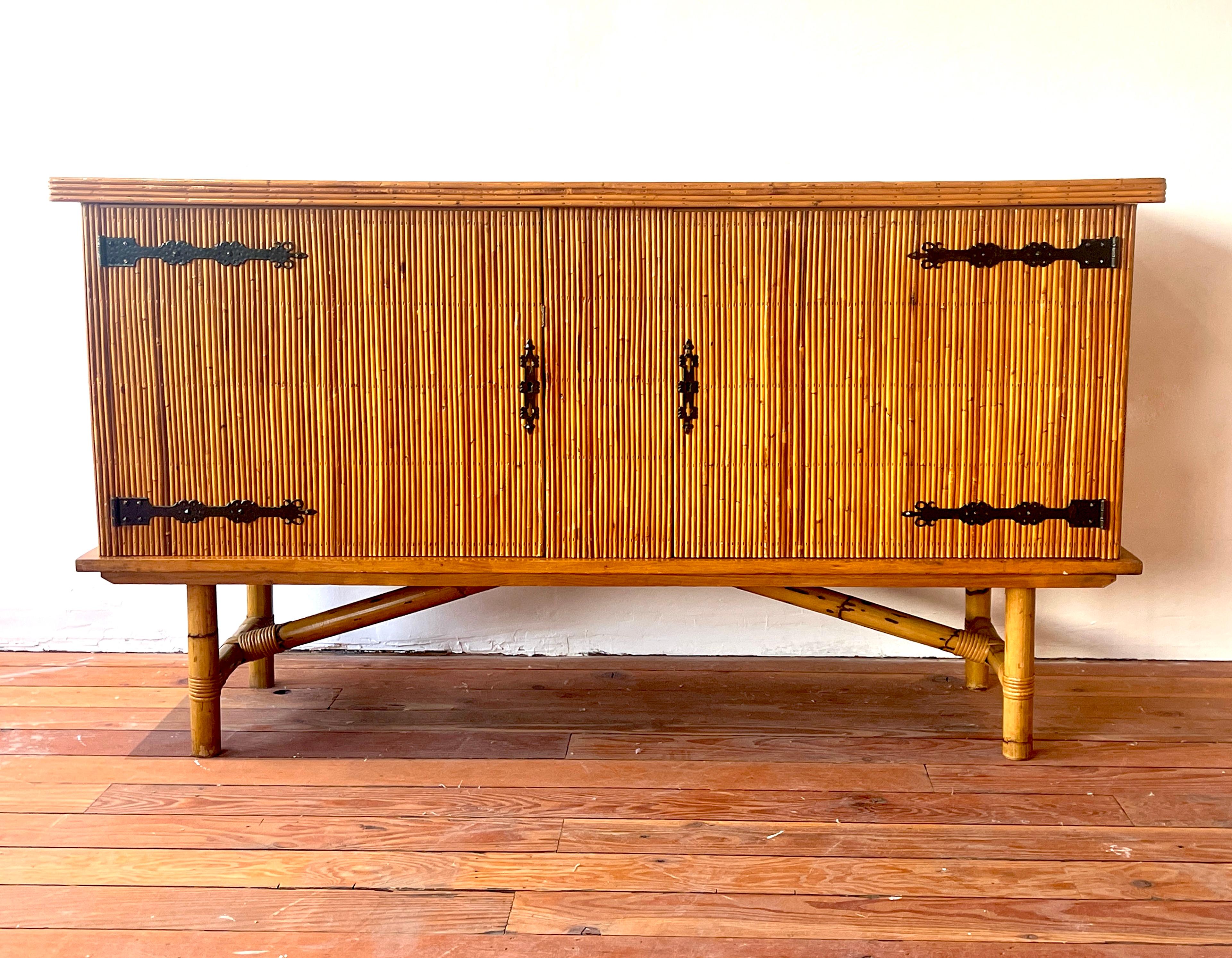 French bamboo sideboard with ornate iron hardware attributed to Alien Audoux and Frida Minet, circa 1960's.
Wonderful patina throughout. 