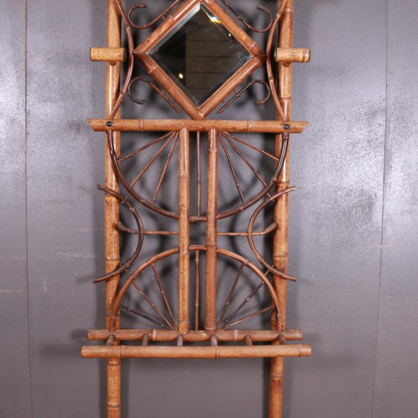 Small 19th century French bamboo hall stand, 1880.

Dimensions:
28 inches (71 cms) wide
10 inches (25 cms) deep
83 inches (211 cms) high.