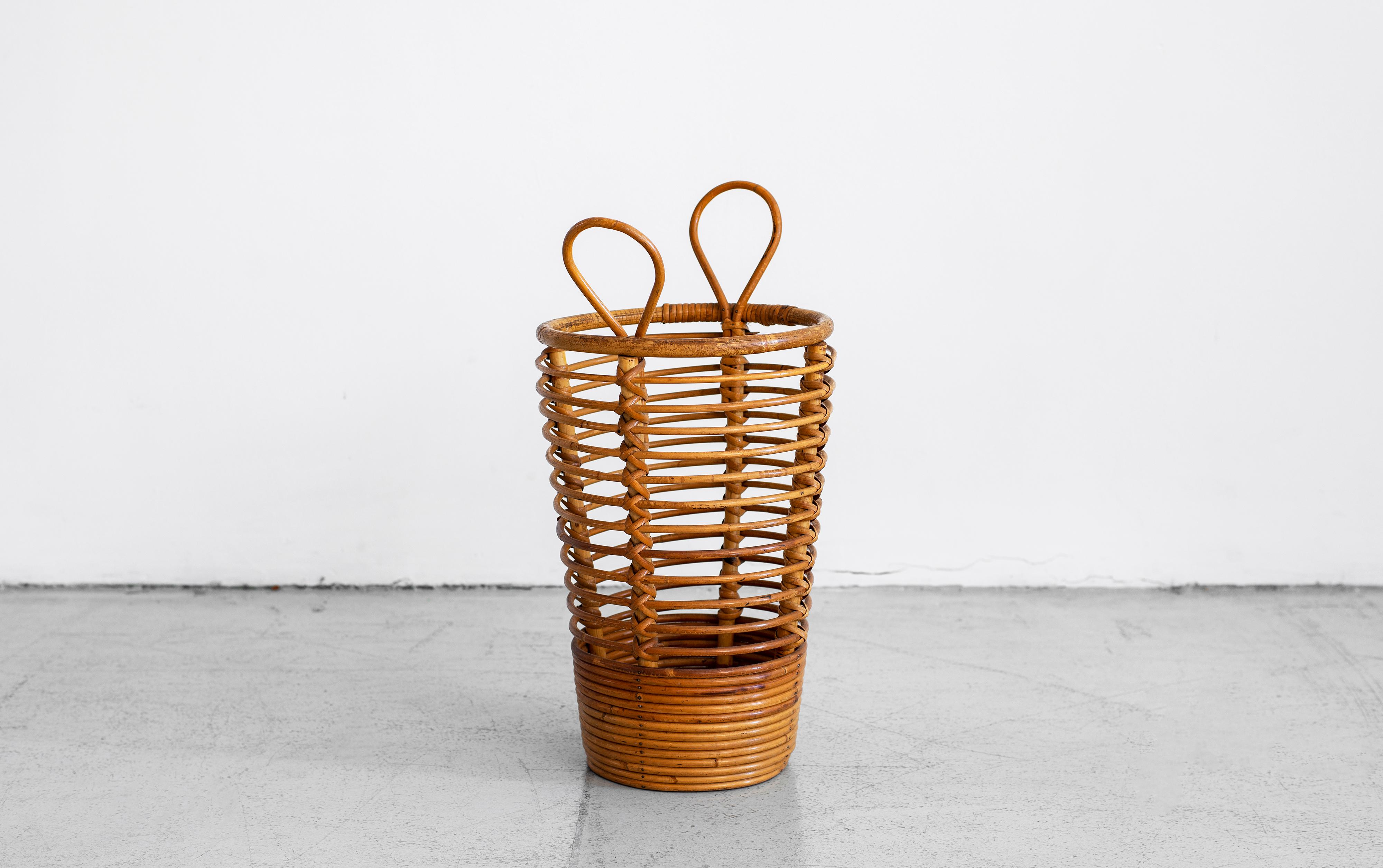 Great rattan umbrella holder made in France. Nice size with sturdy rattan ring detailing and two handles.
